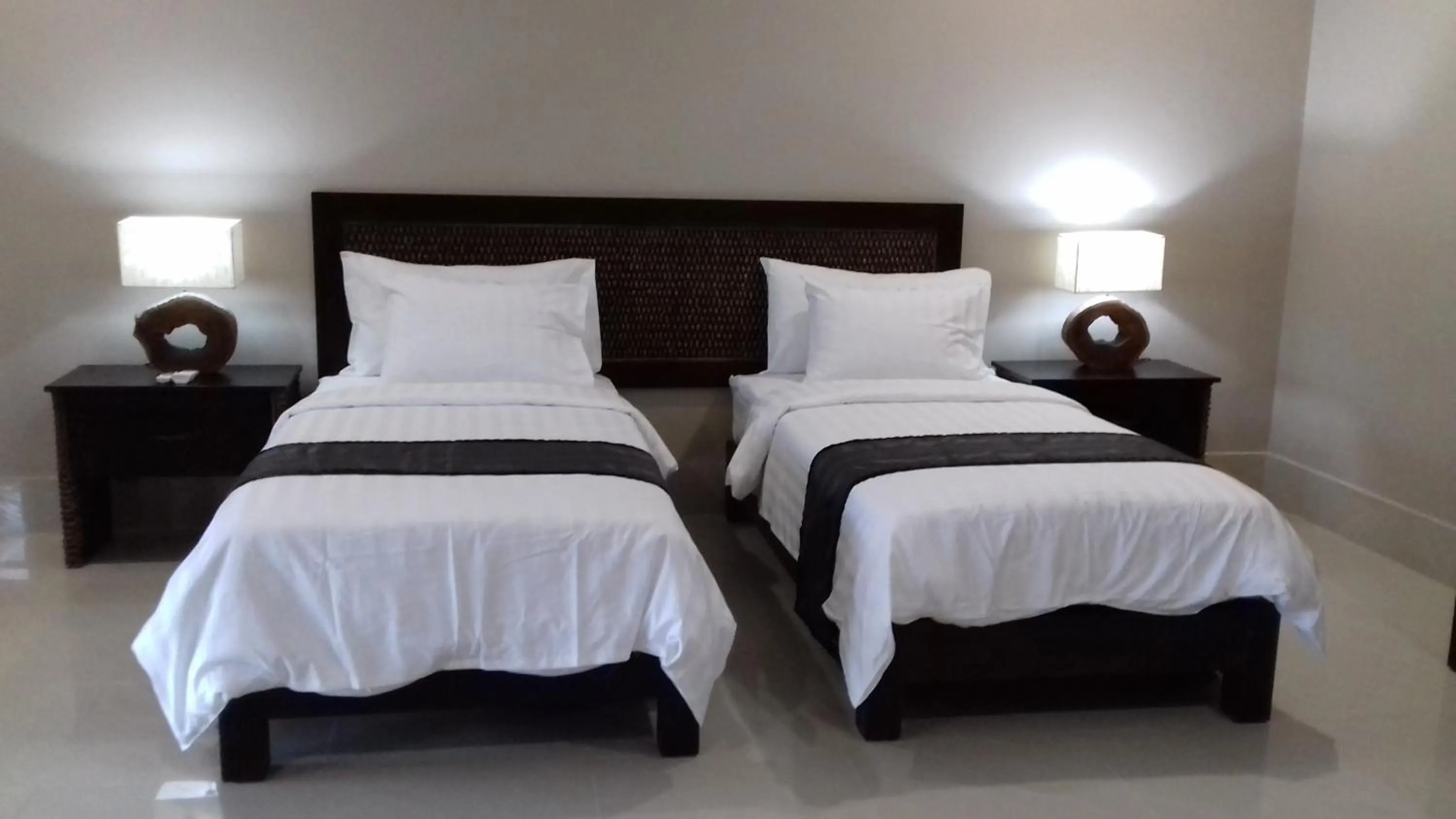 Bed in Gili Palms Villas