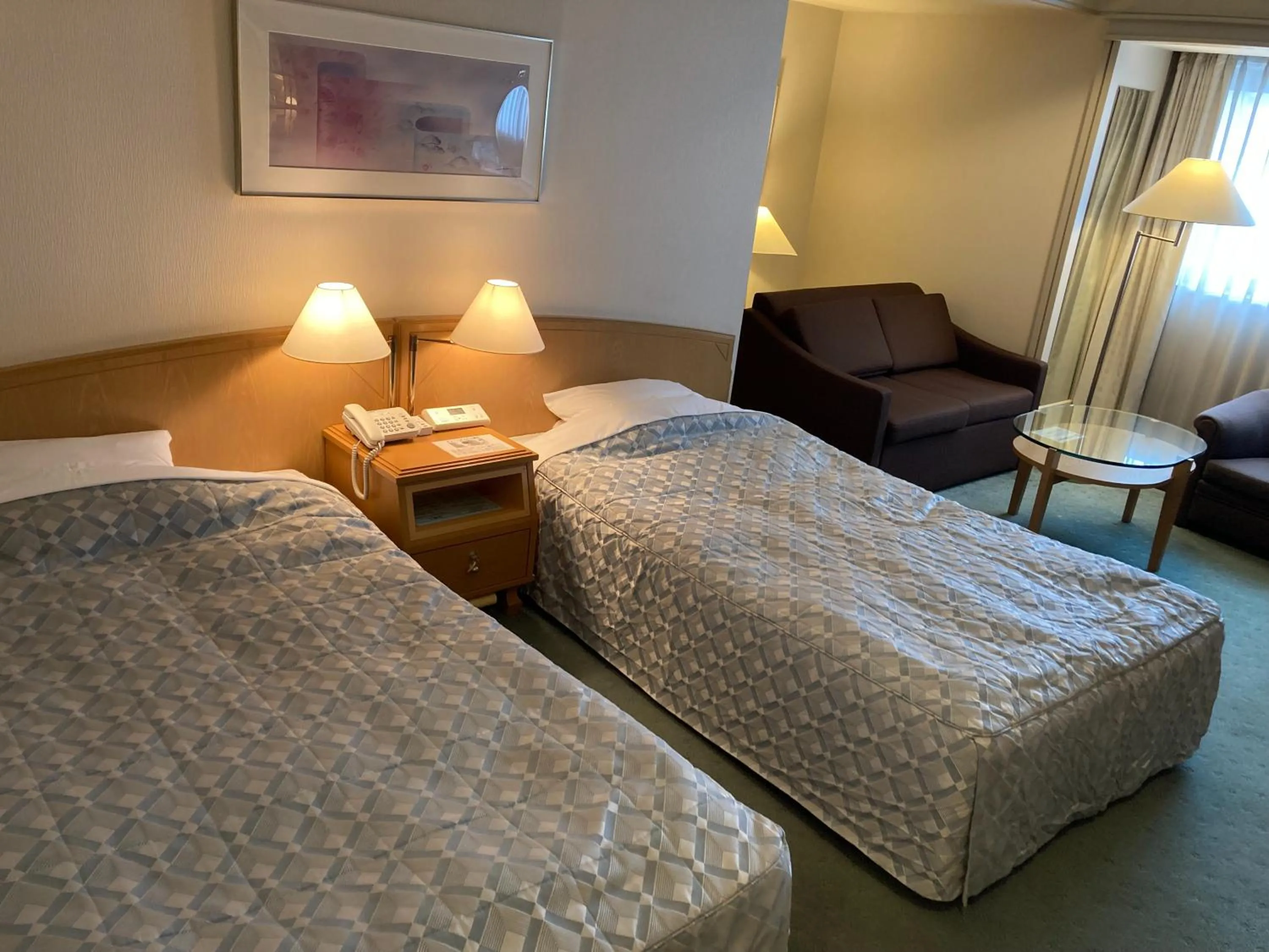 Bed in Jasmac Plaza Hotel