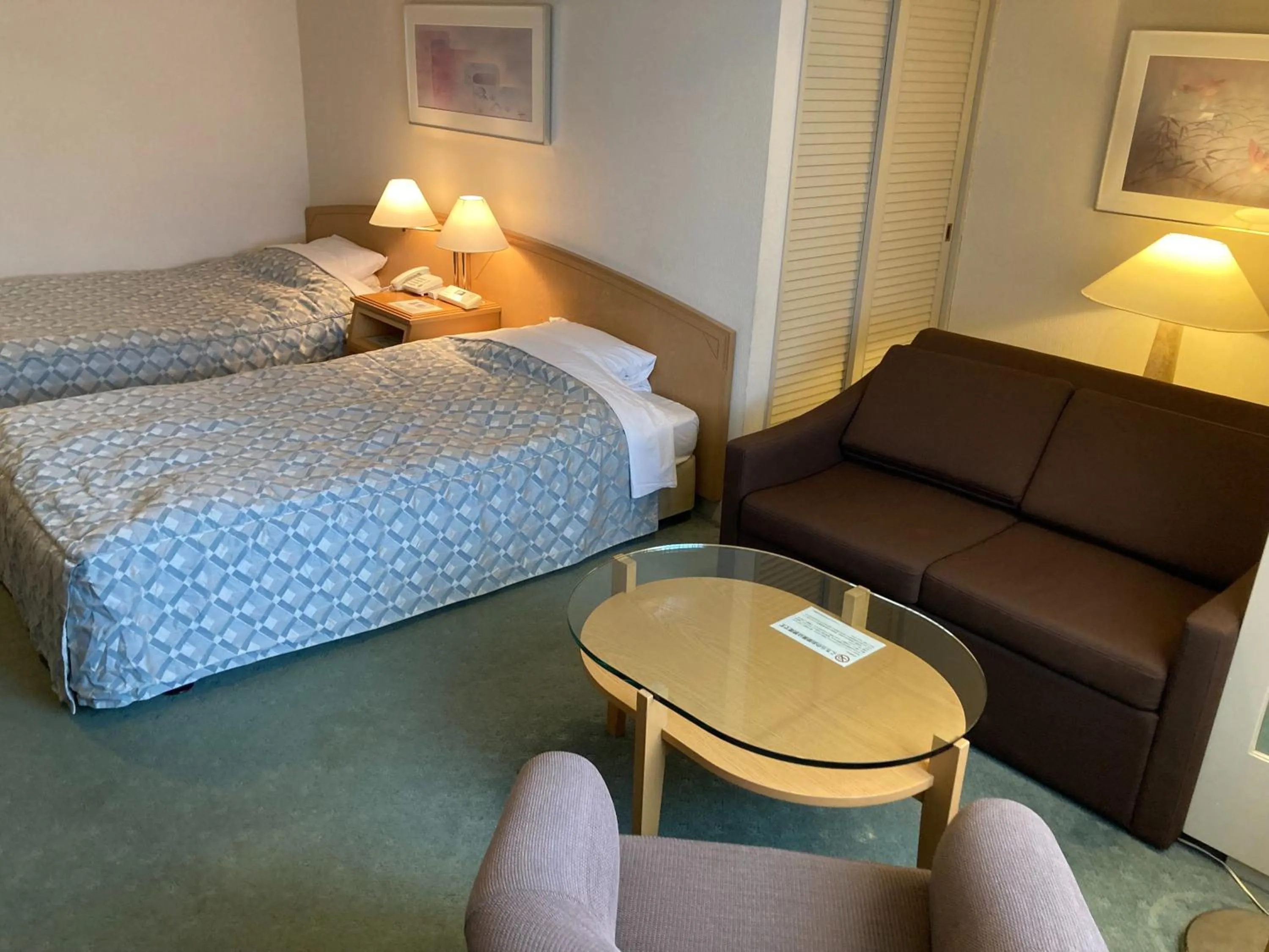 Bed in Jasmac Plaza Hotel