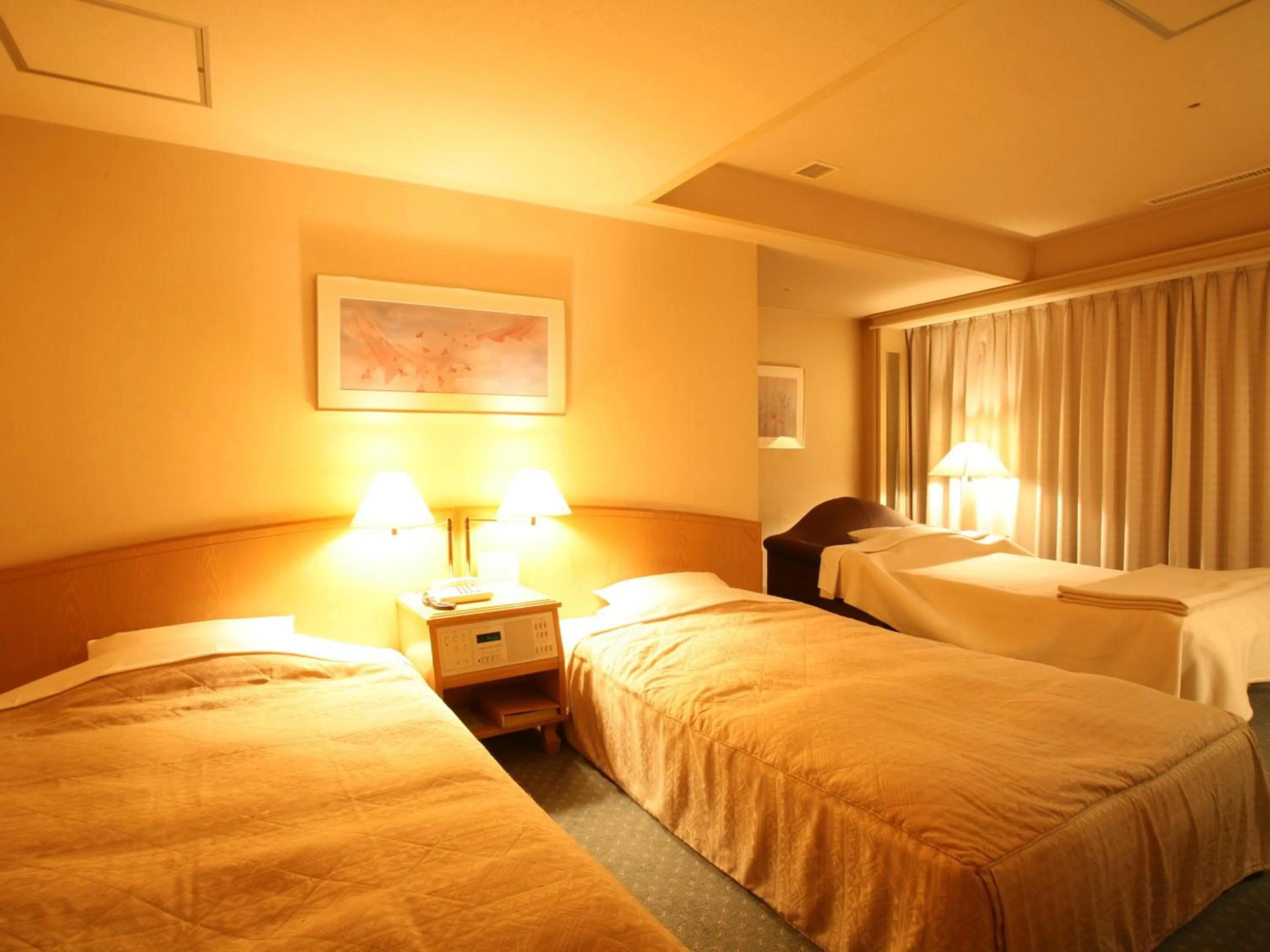 Bed in Jasmac Plaza Hotel