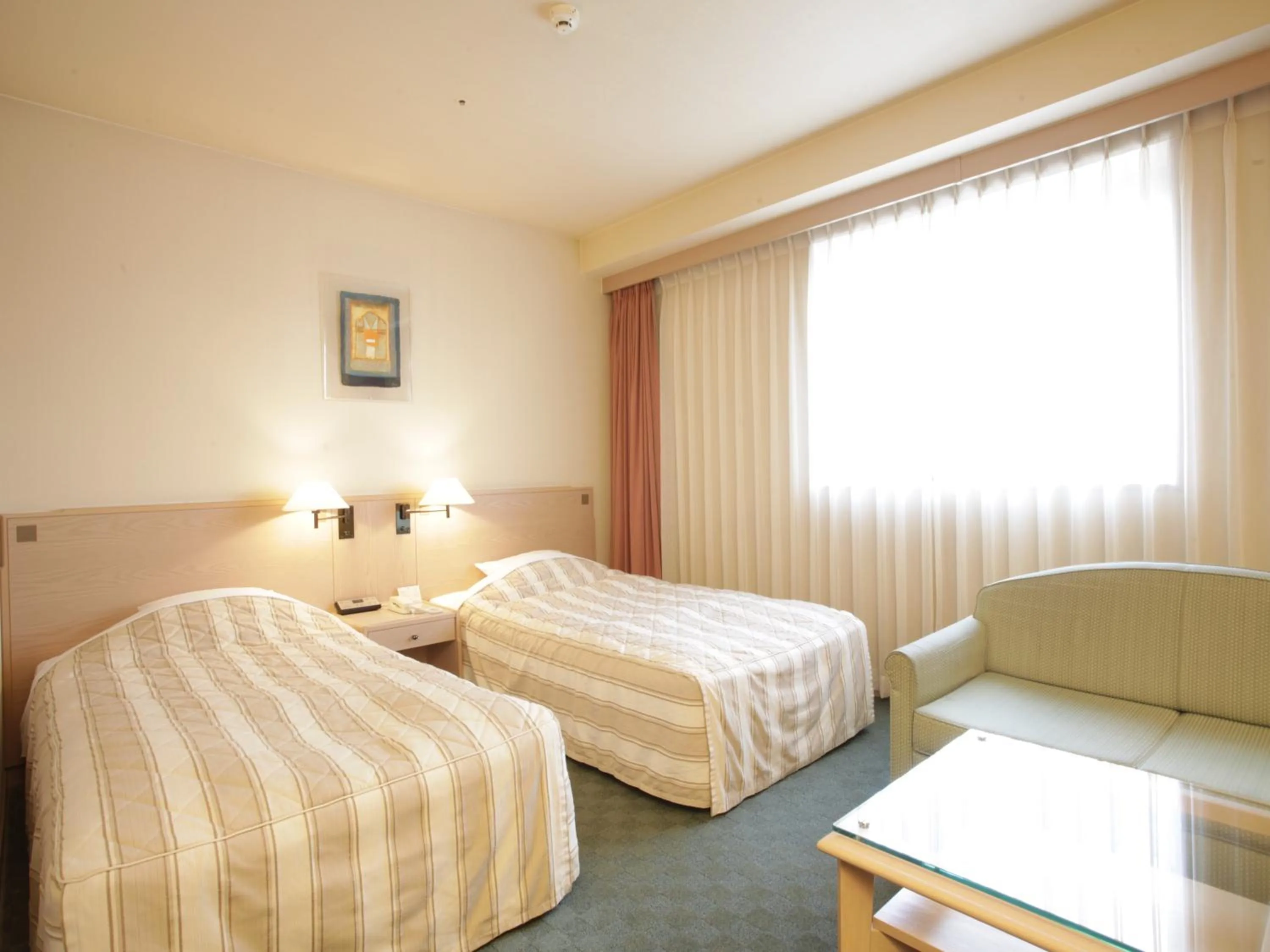 Bed in Jasmac Plaza Hotel