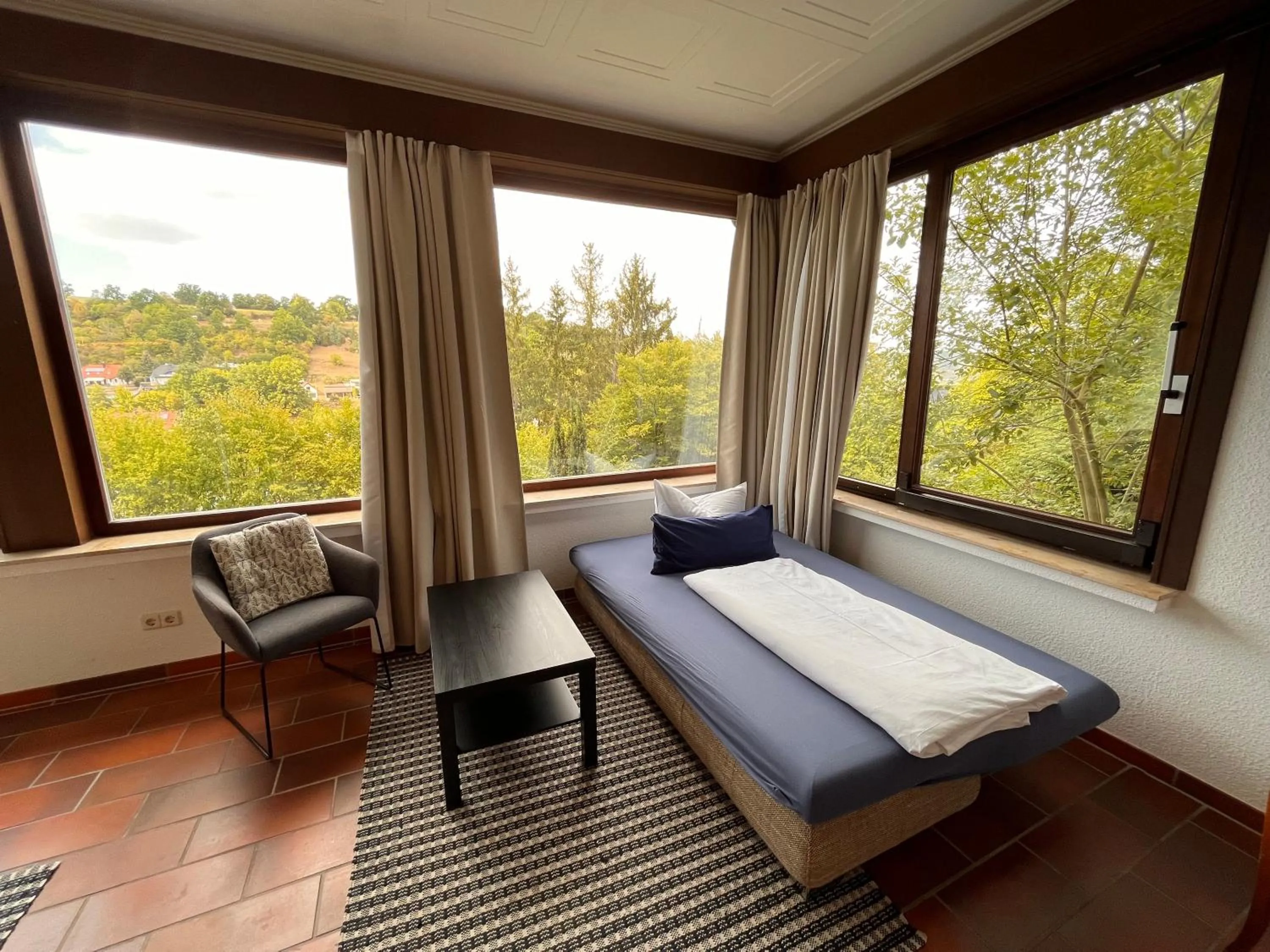 Seating area, Bed in Haus am Wald