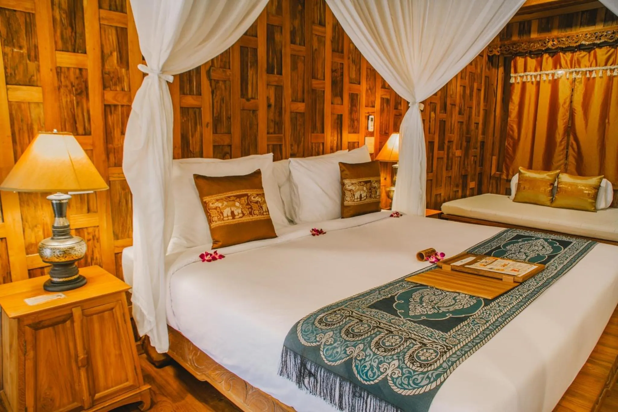 Bed in Santhiya Koh Phangan Resort and Spa