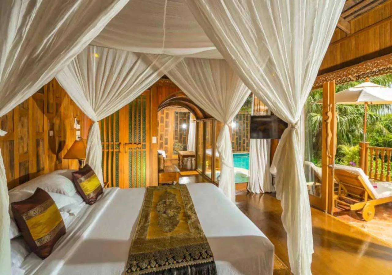 Bed in Santhiya Koh Phangan Resort and Spa