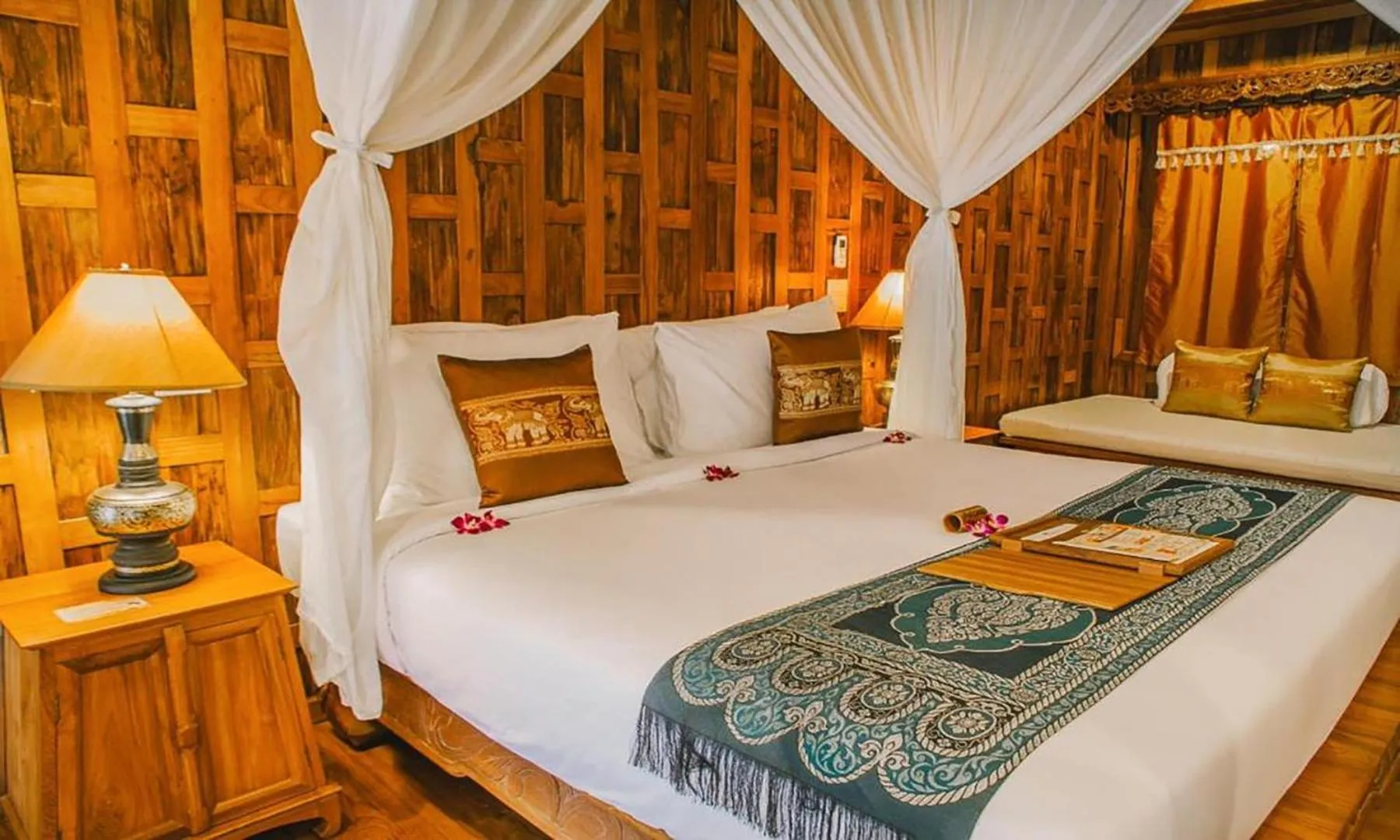 Bed in Santhiya Koh Phangan Resort and Spa