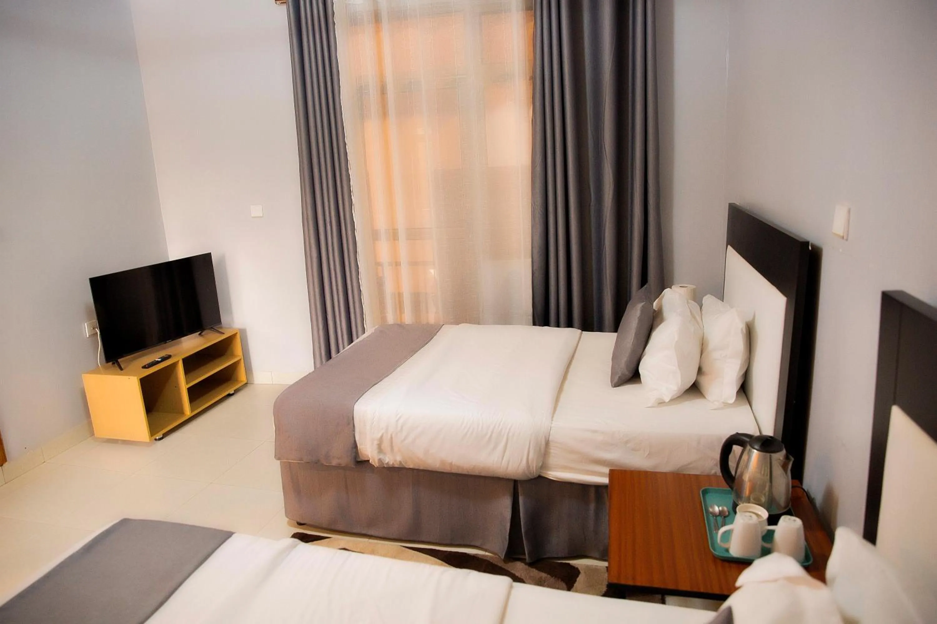 Bed in Romalo Hotel & Apartments