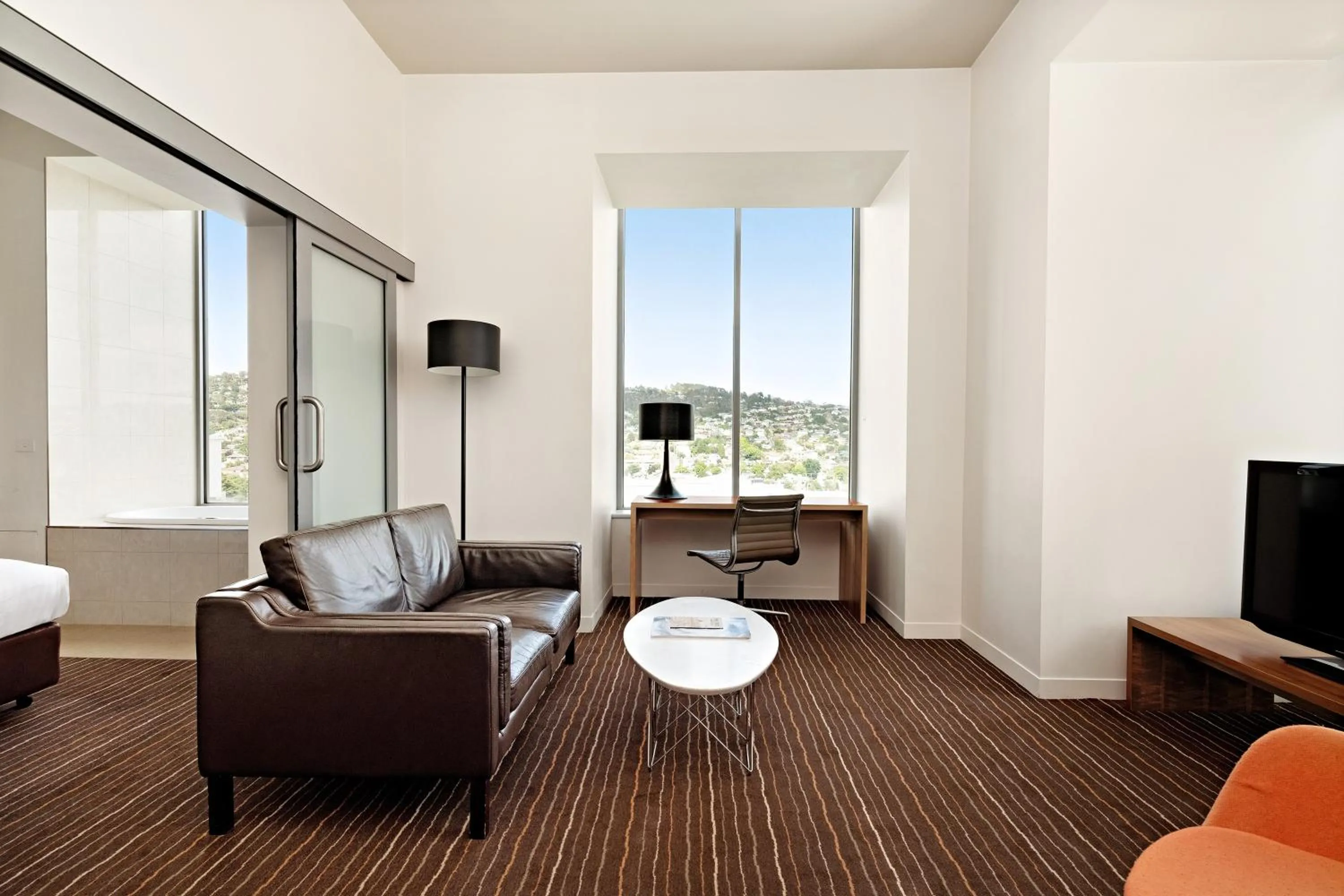 Living room in Mantra Charles Hotel