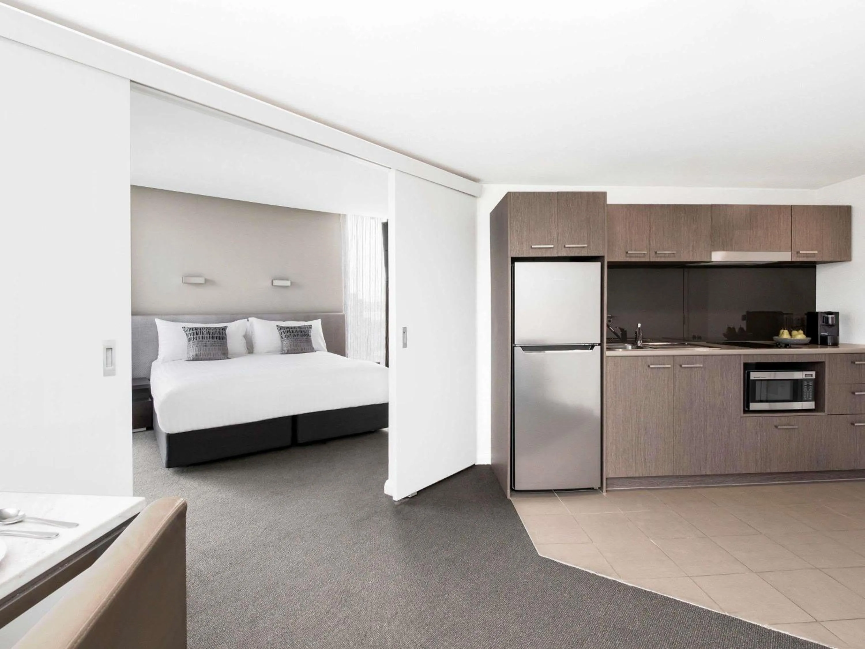 Property building, Bed in Mantra Collins Hotel