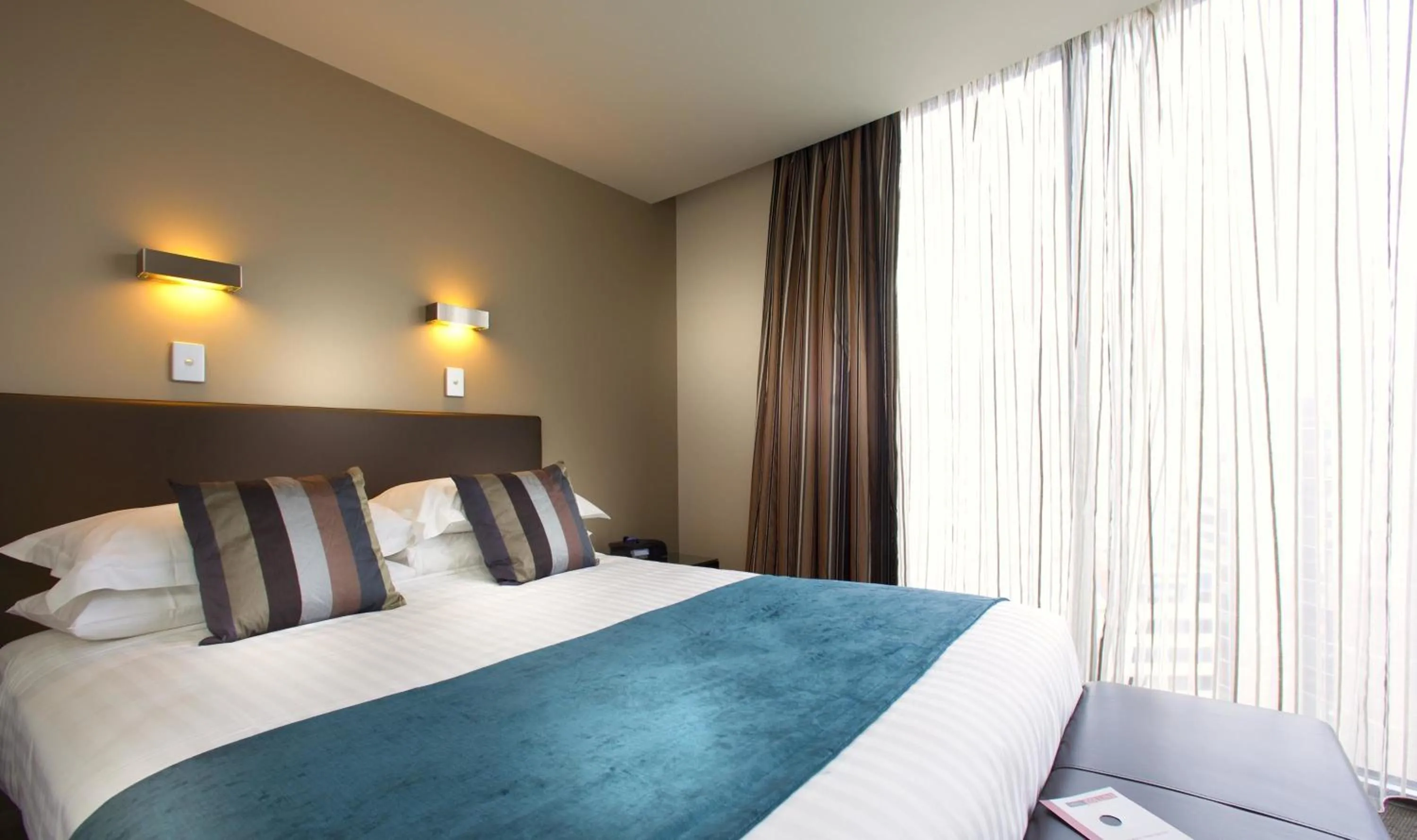 Bedroom, Bed in Mantra Collins Hotel