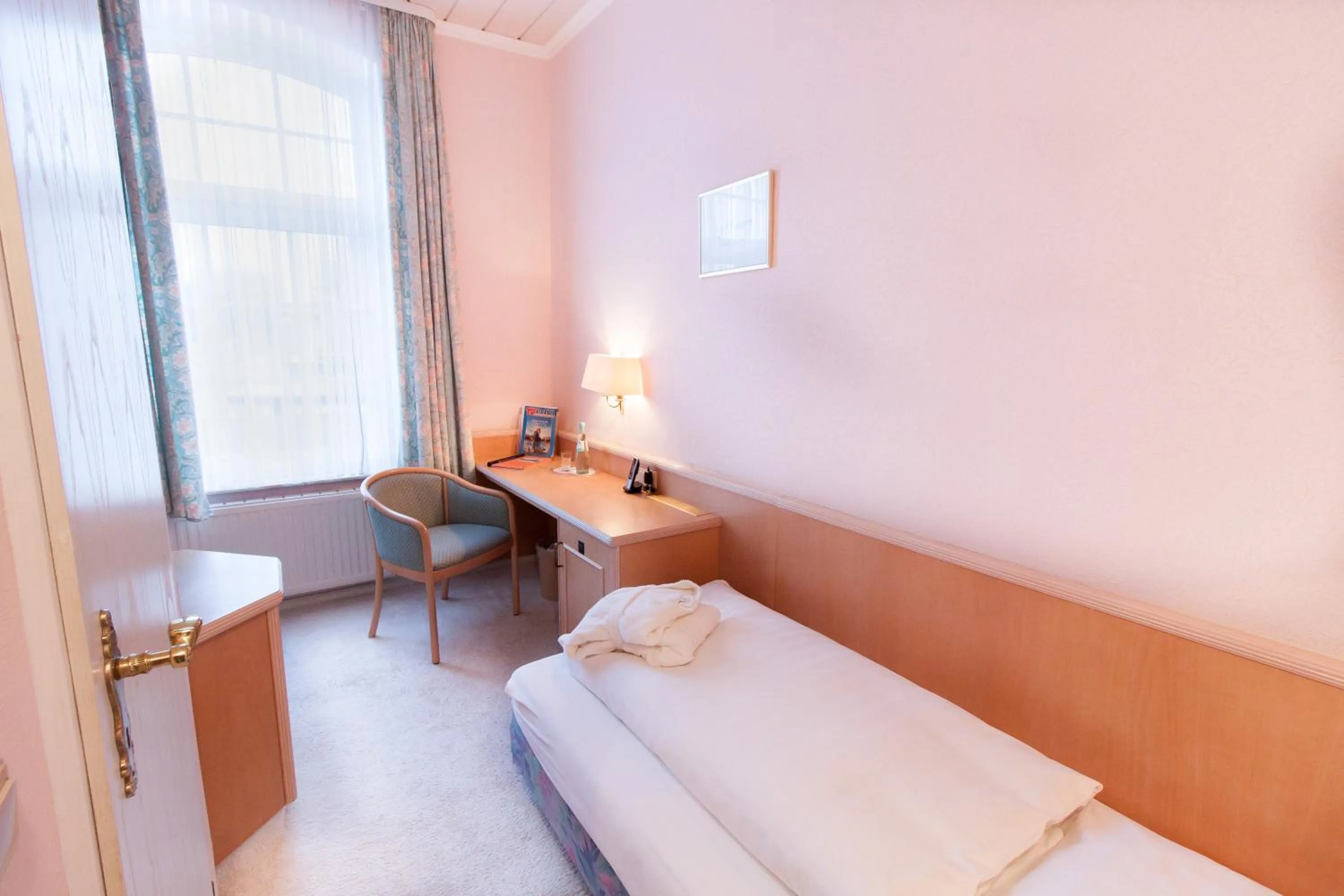 Photo of the whole room, Bed in Nordseehotel Freese