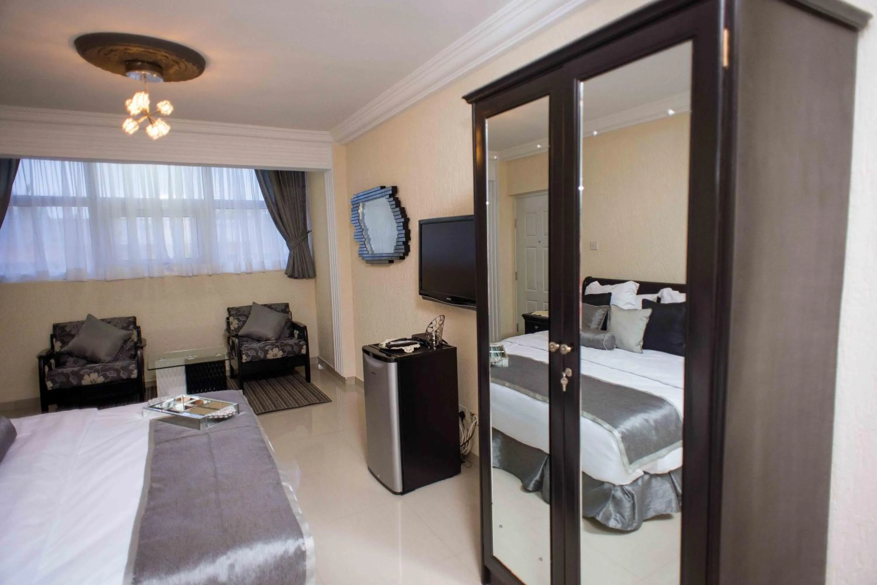 Bed in The Ritzz Exclusive Guest House