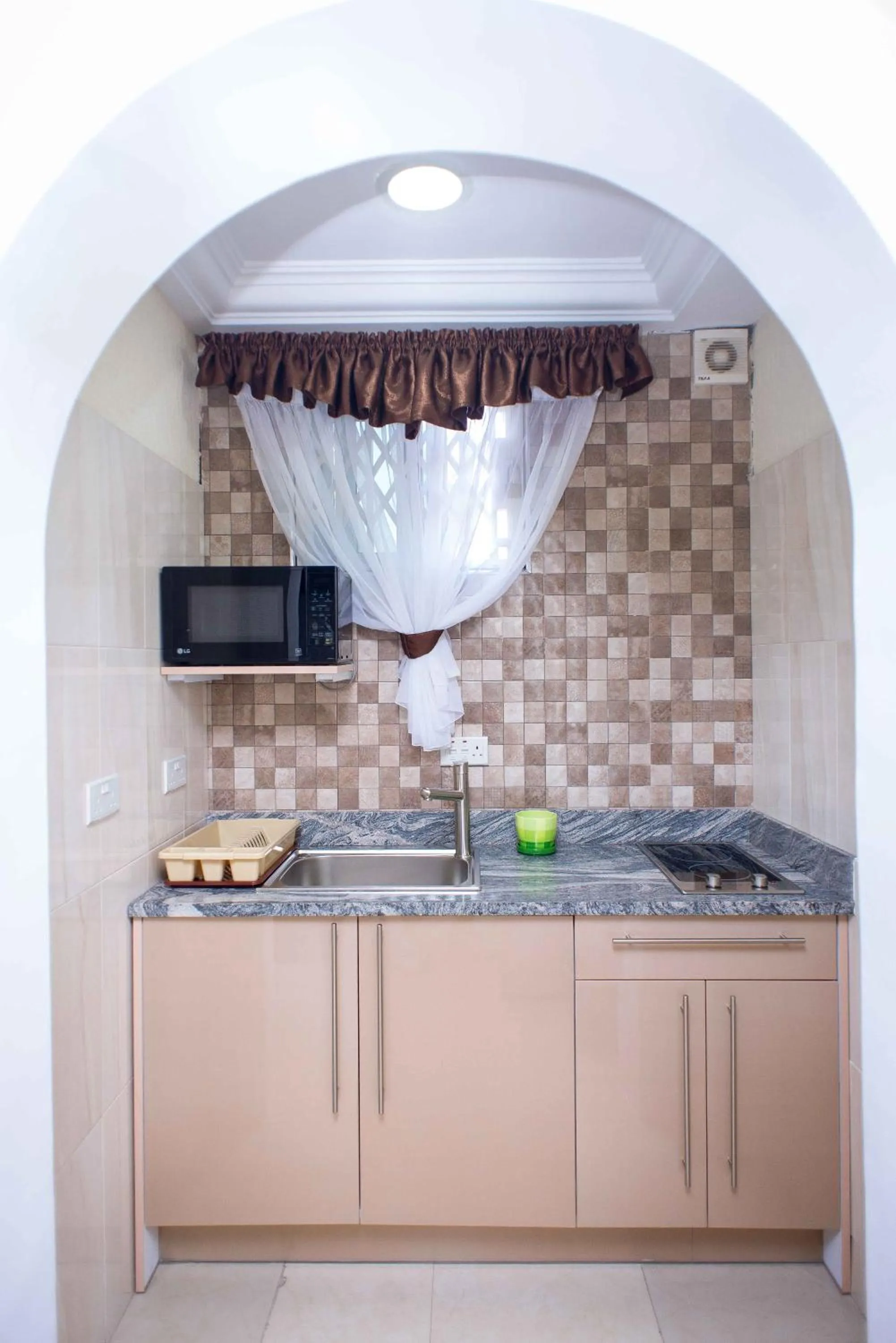 Kitchen or kitchenette in The Ritzz Exclusive Guest House
