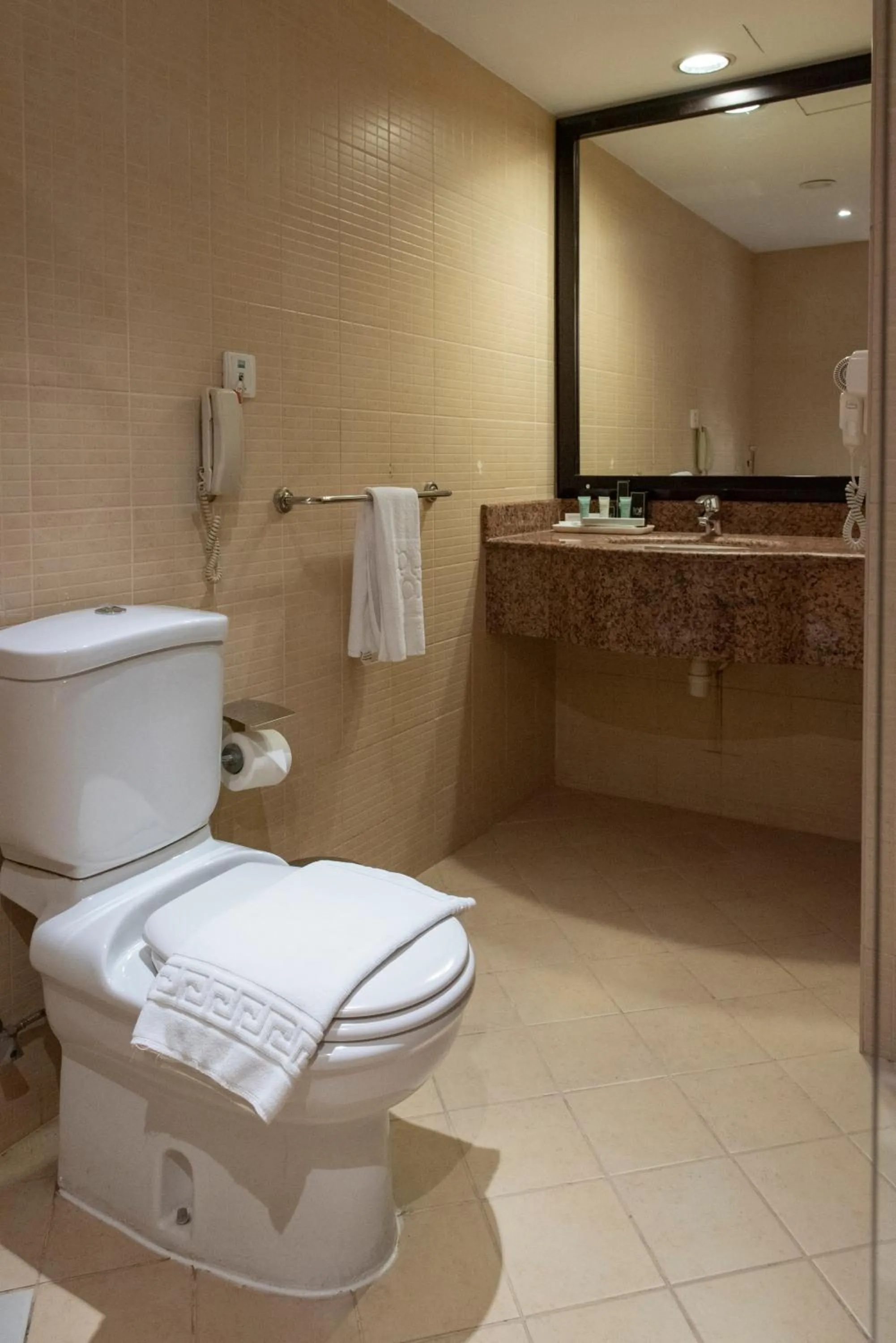 Bedroom in Corp Executive Hotel Doha Suites