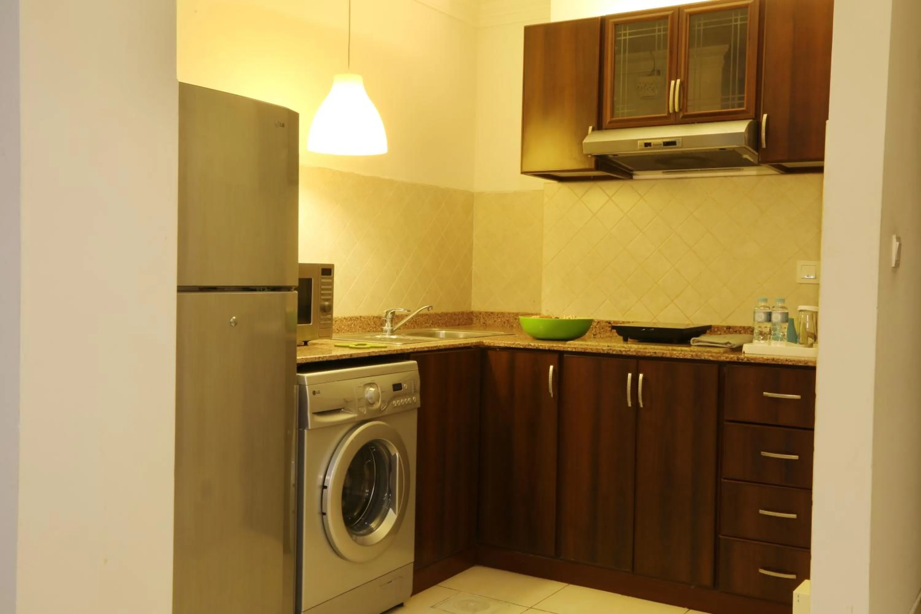 Kitchen or kitchenette in Corp Executive Hotel Doha Suites