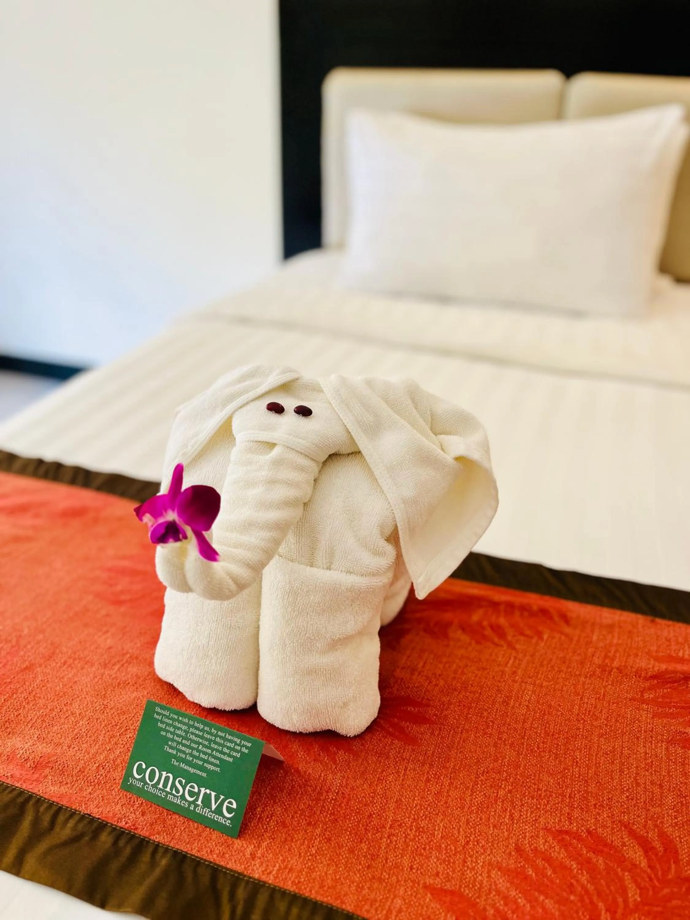 towels, Bed in Woraburi Phuket Resort & Spa - SHA Plus