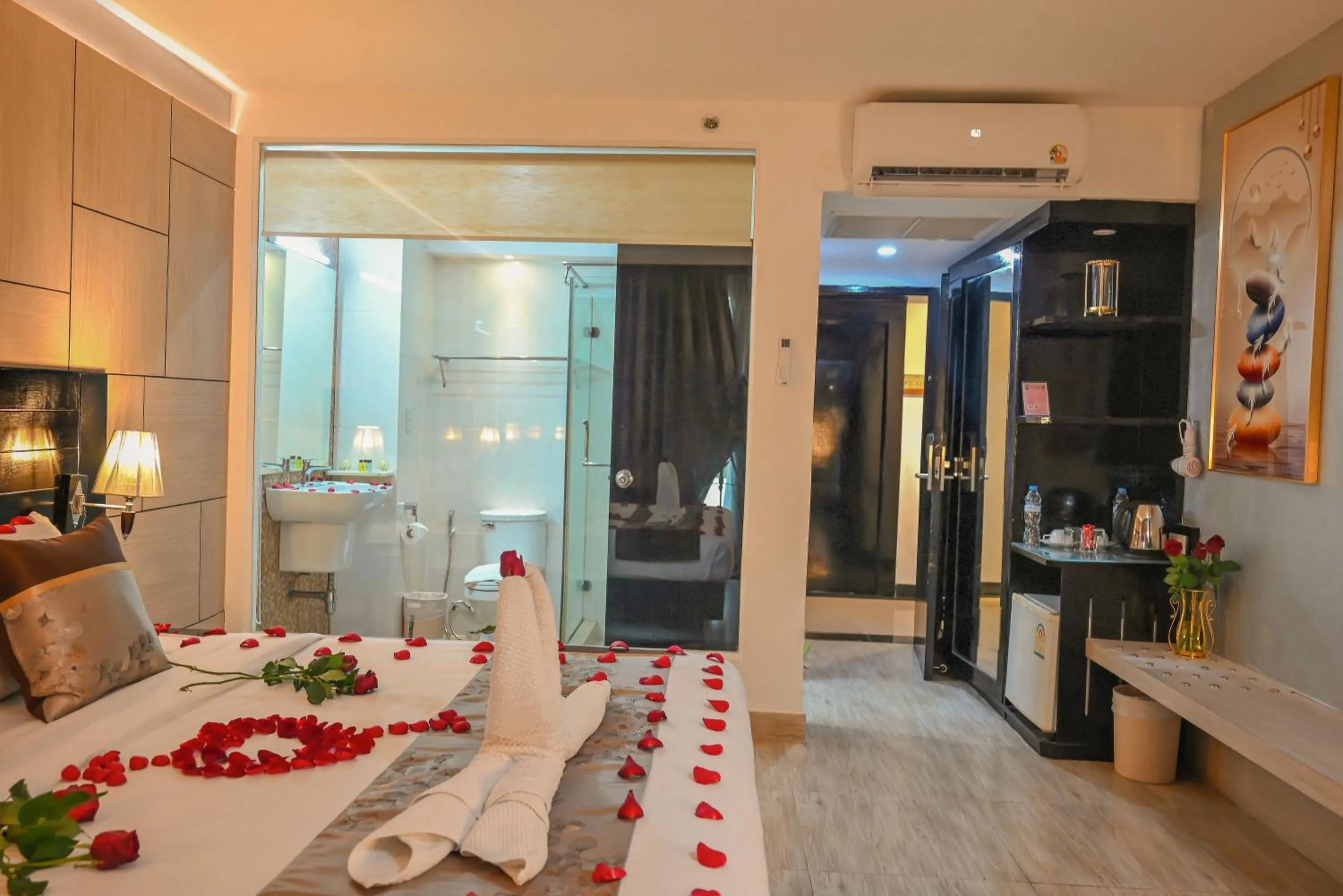 Bed in Boss Suites Nana Hotel