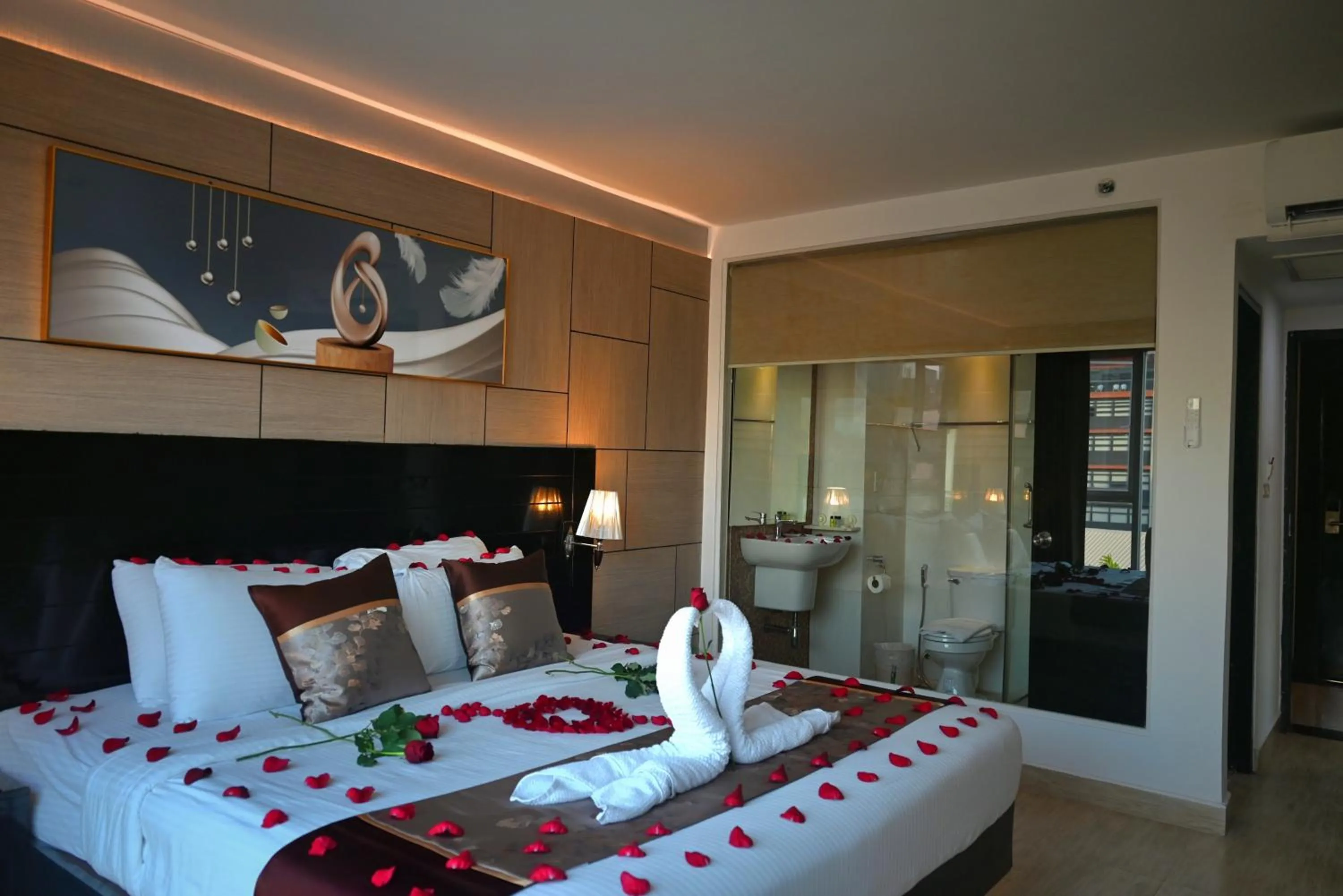 Bed in Boss Suites Nana Hotel