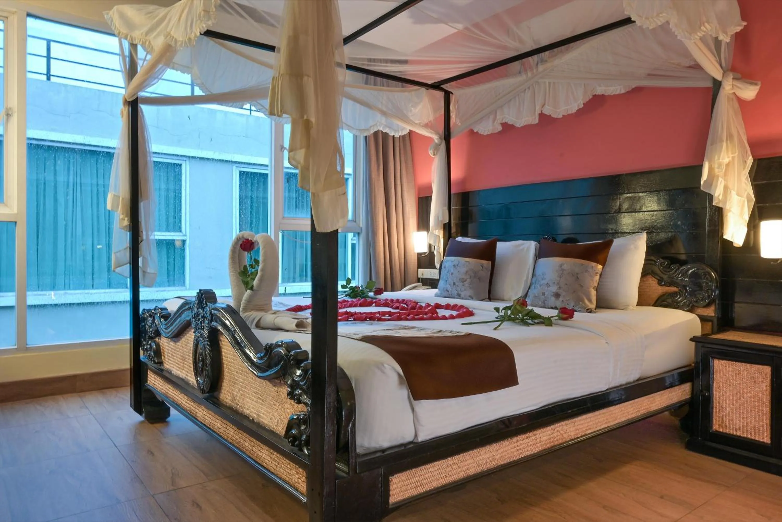 Bed in Boss Suites Nana Hotel