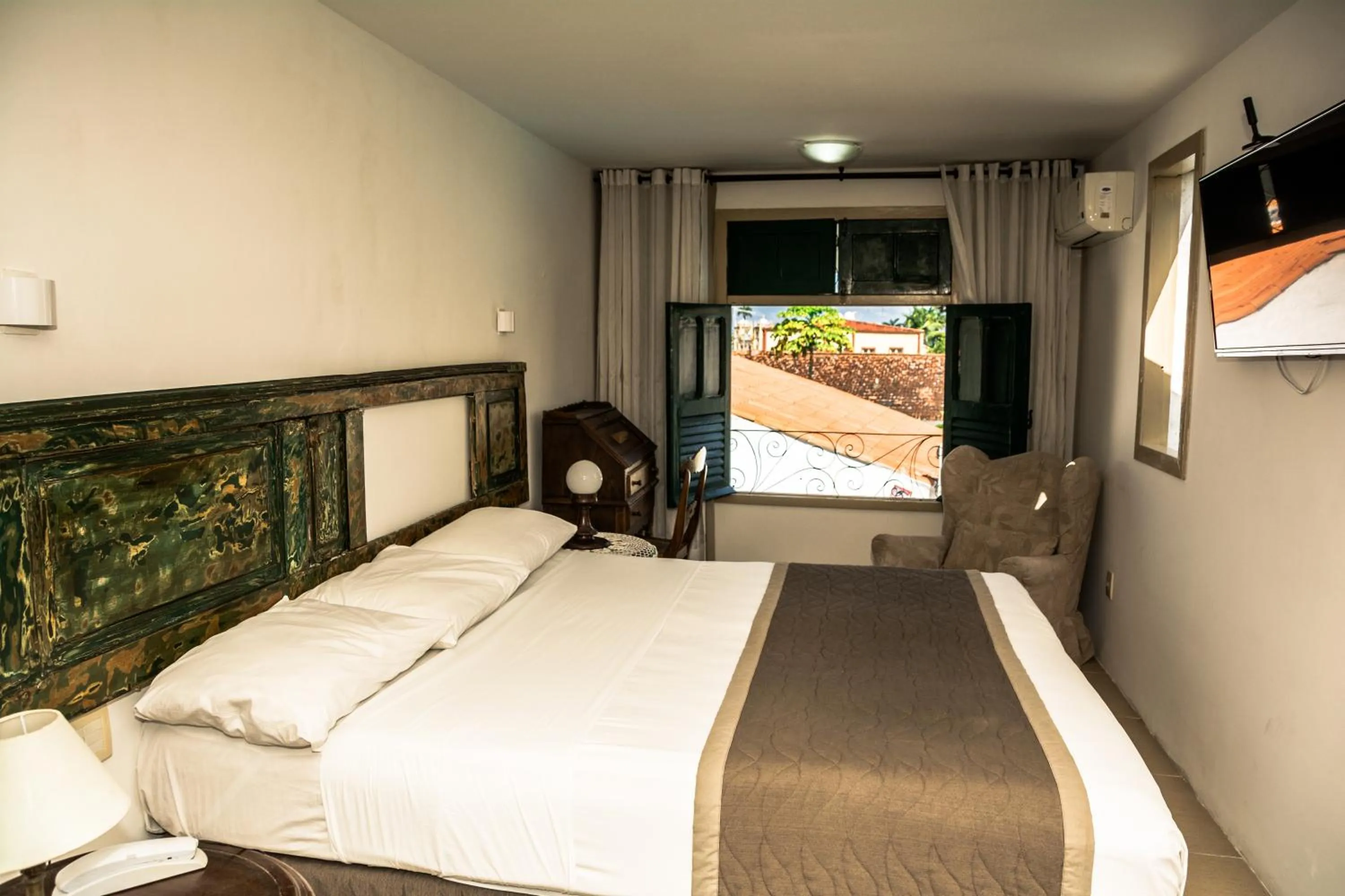 Bed in Pousada dos Quatro Cantos