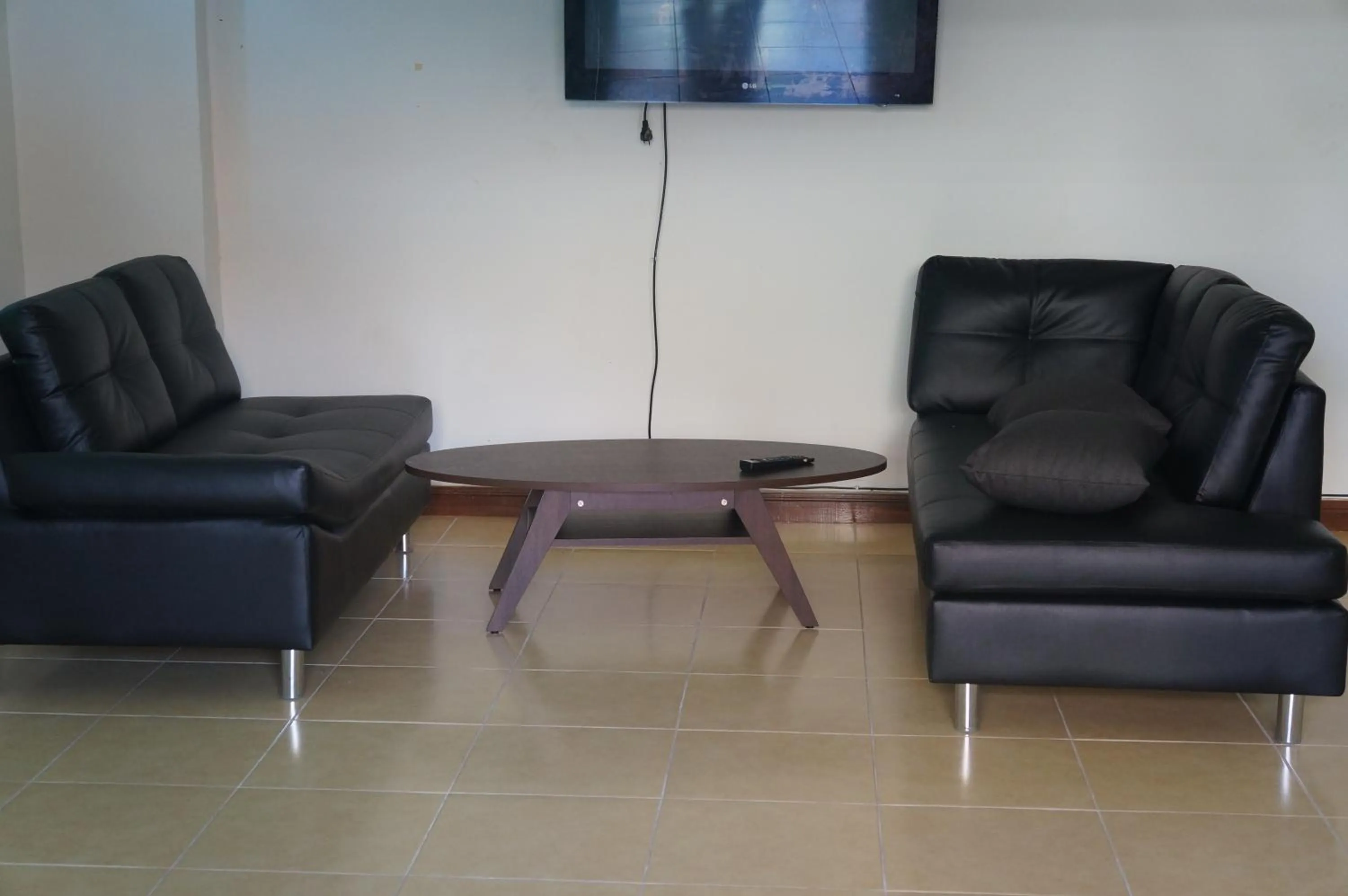 Communal lounge/ TV room in Lamai Apartment