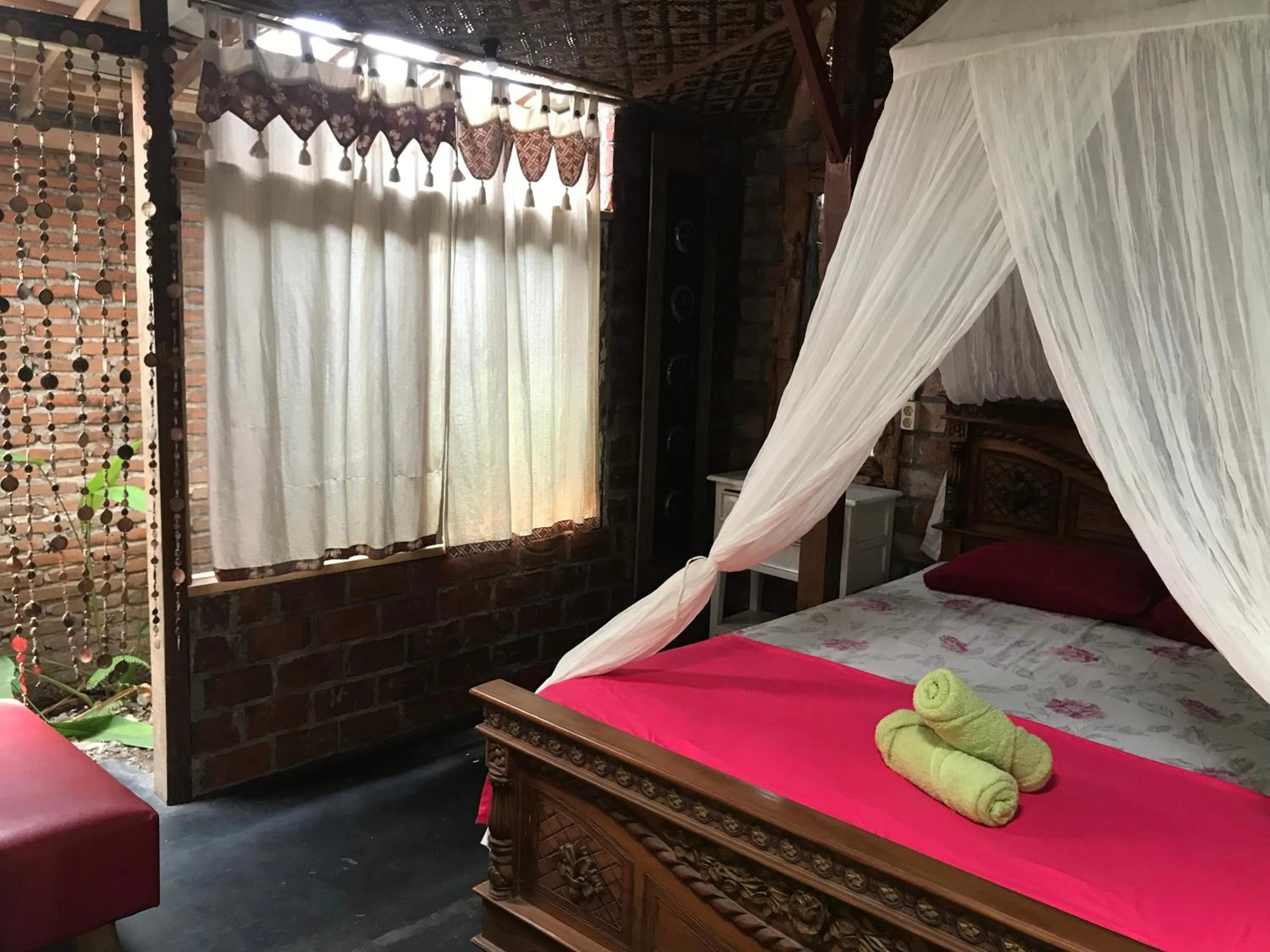 Bed in Arjuna Garden Homestay