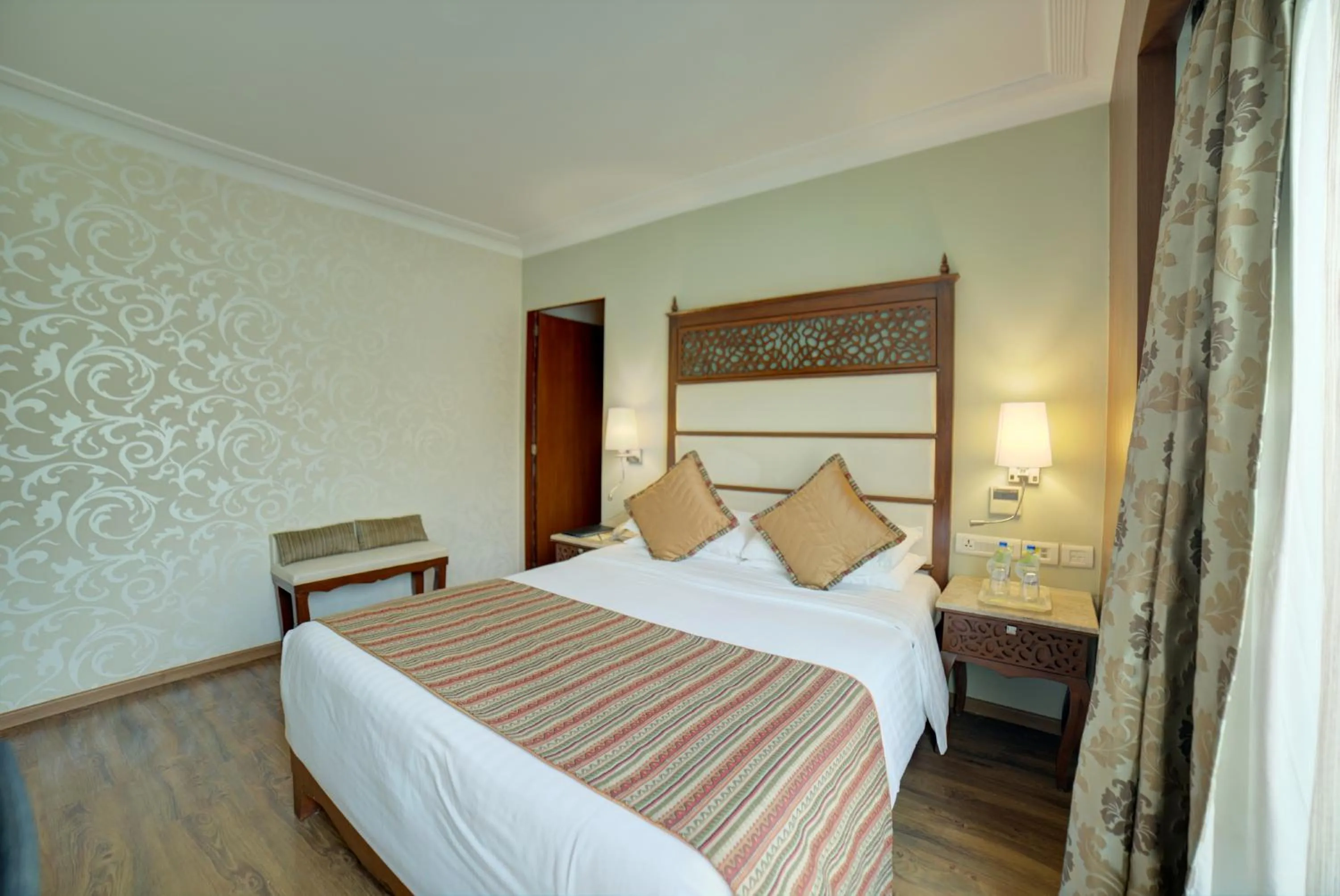 Photo of the whole room, Bed in Goldfinch Hotel Bangalore