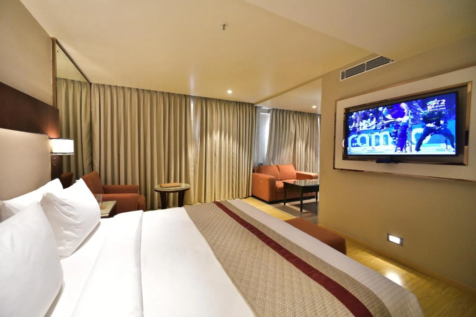 Bedroom, Bed in Citadel Sarovar Portico Bengaluru