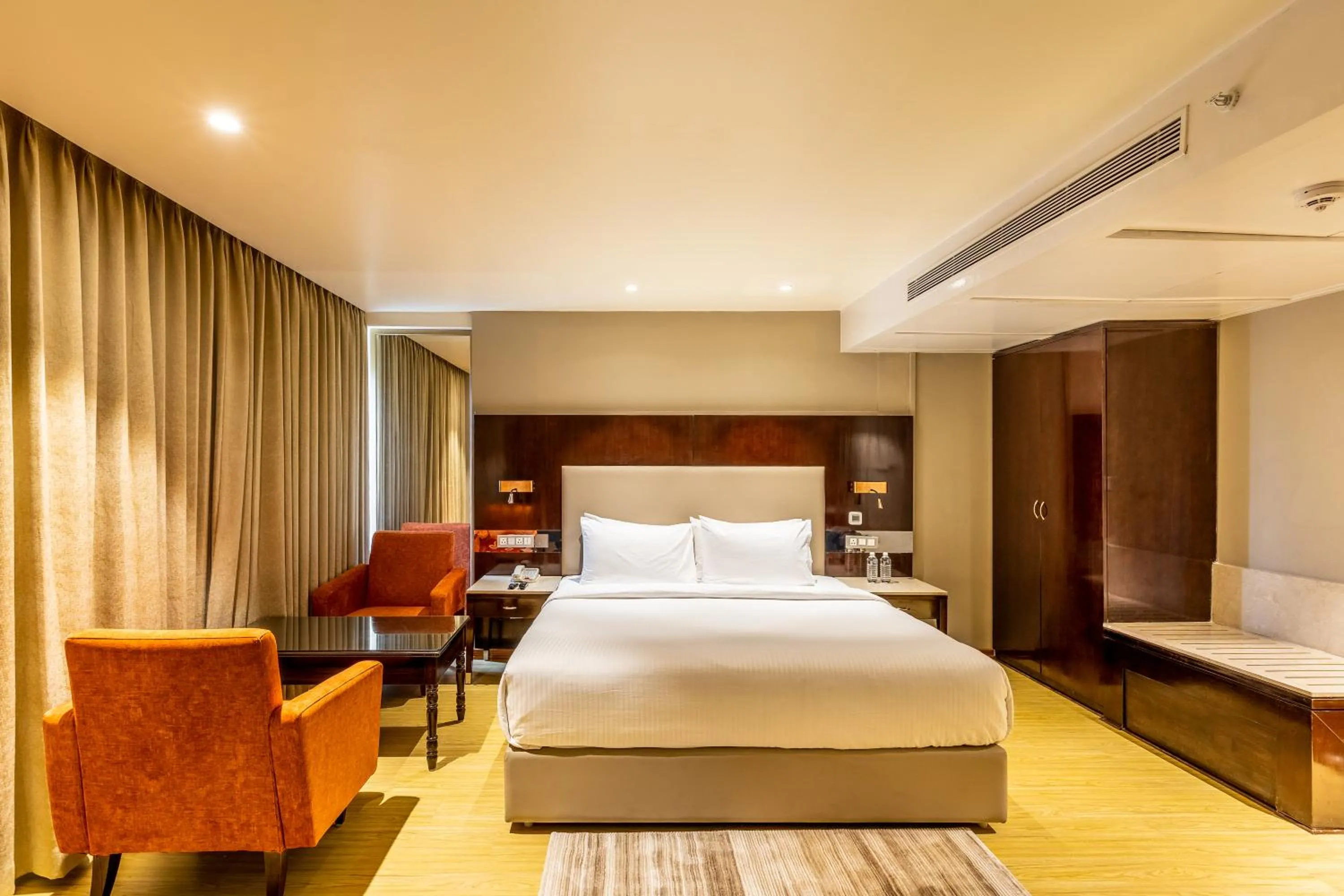 Bedroom, Bed in Citadel Sarovar Portico Bengaluru