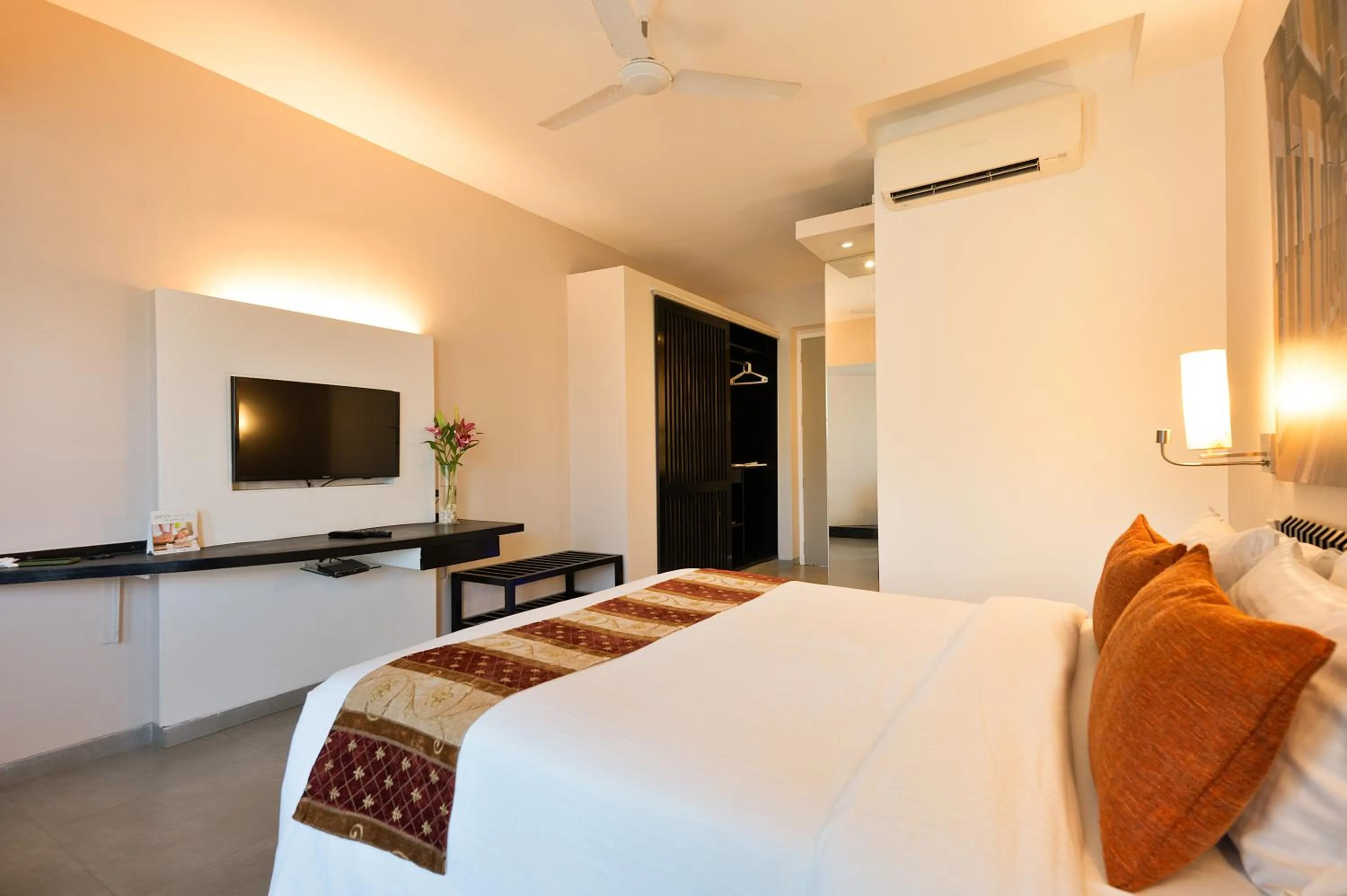 Bed in Whispering Palms Beach Resort