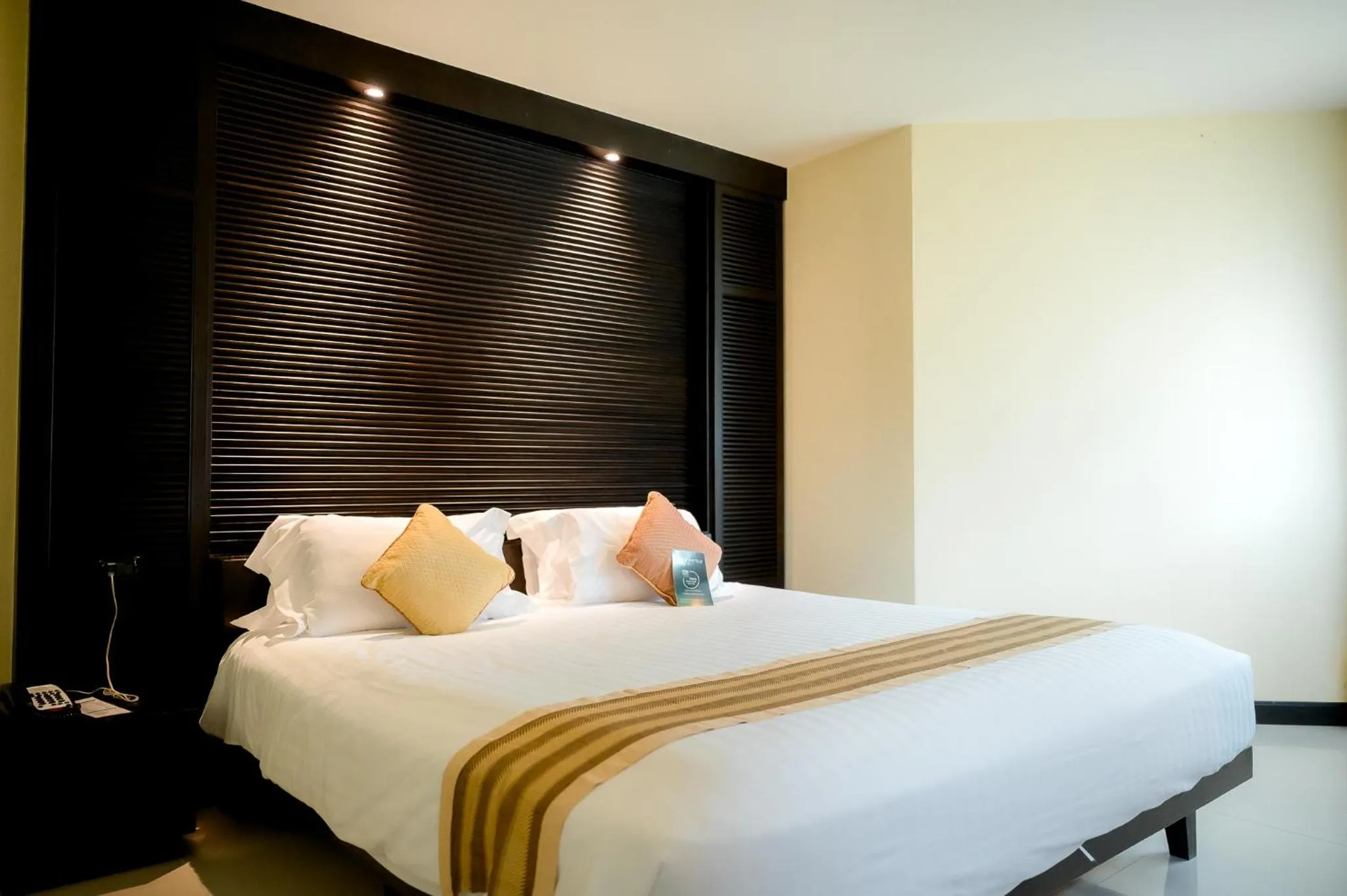 Bed in The Nouveau Chumphon Beach Resort And Golf