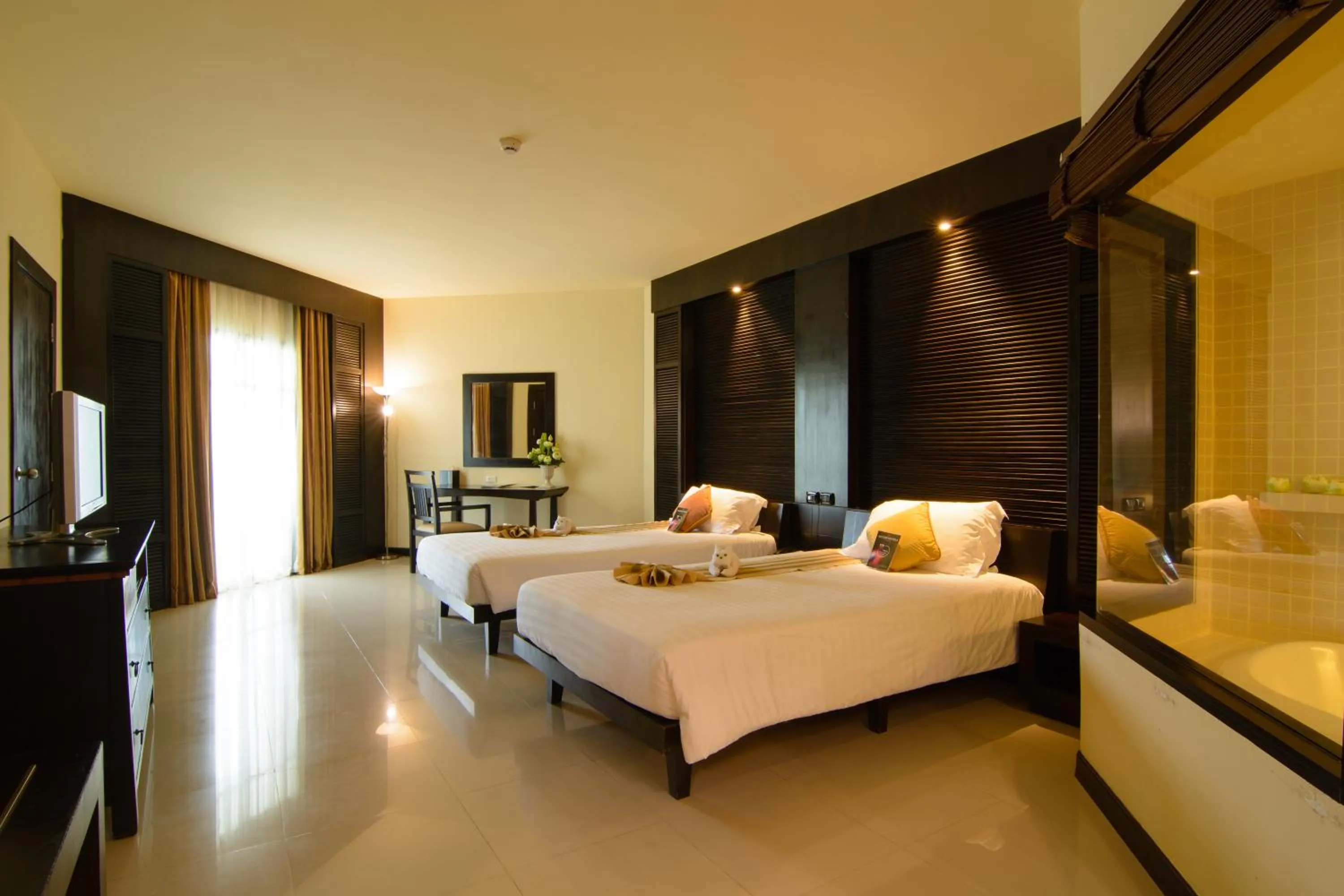 Bed in The Nouveau Chumphon Beach Resort And Golf