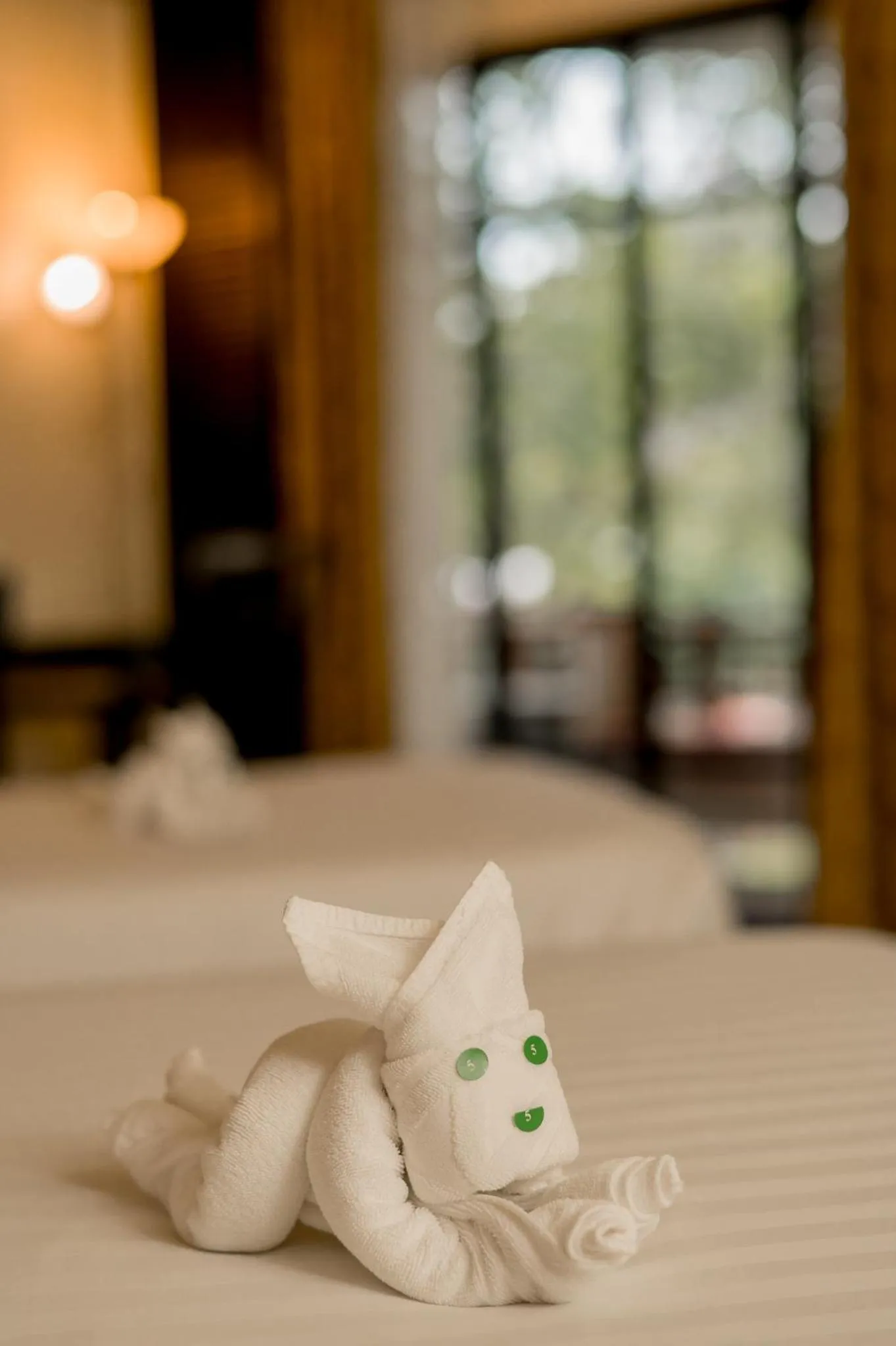 Bed in The Nouveau Chumphon Beach Resort And Golf