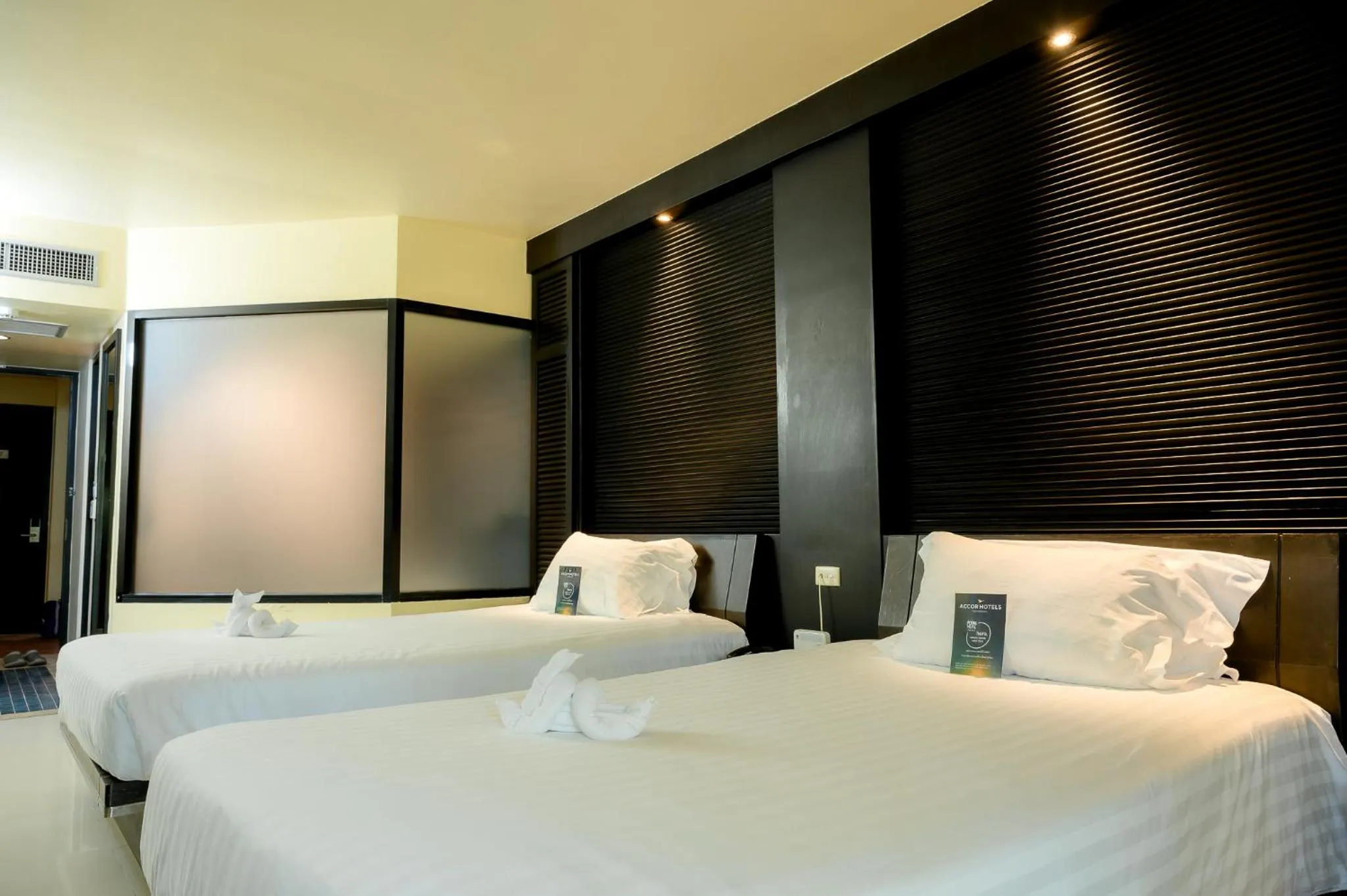 Bed in The Nouveau Chumphon Beach Resort And Golf