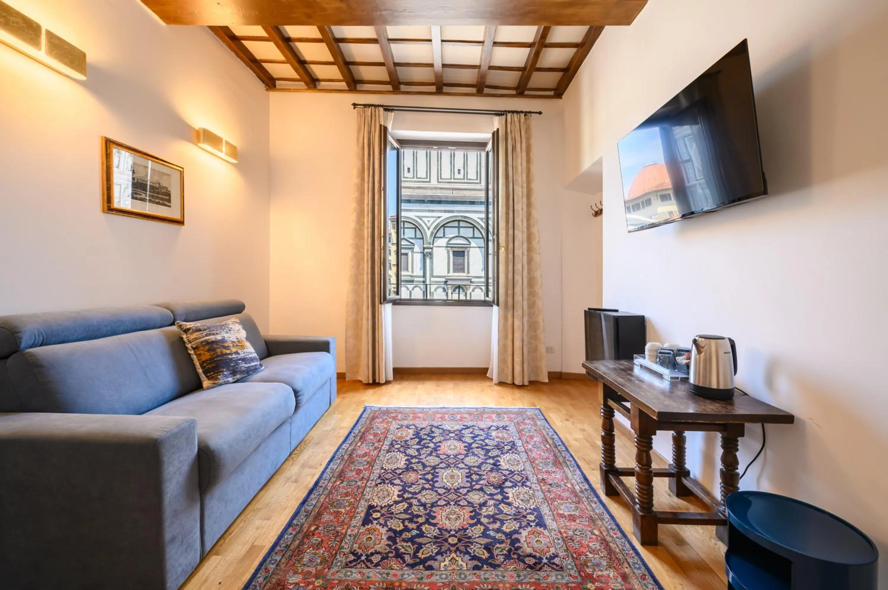 Communal lounge/ TV room in B&B Soggiorno Battistero