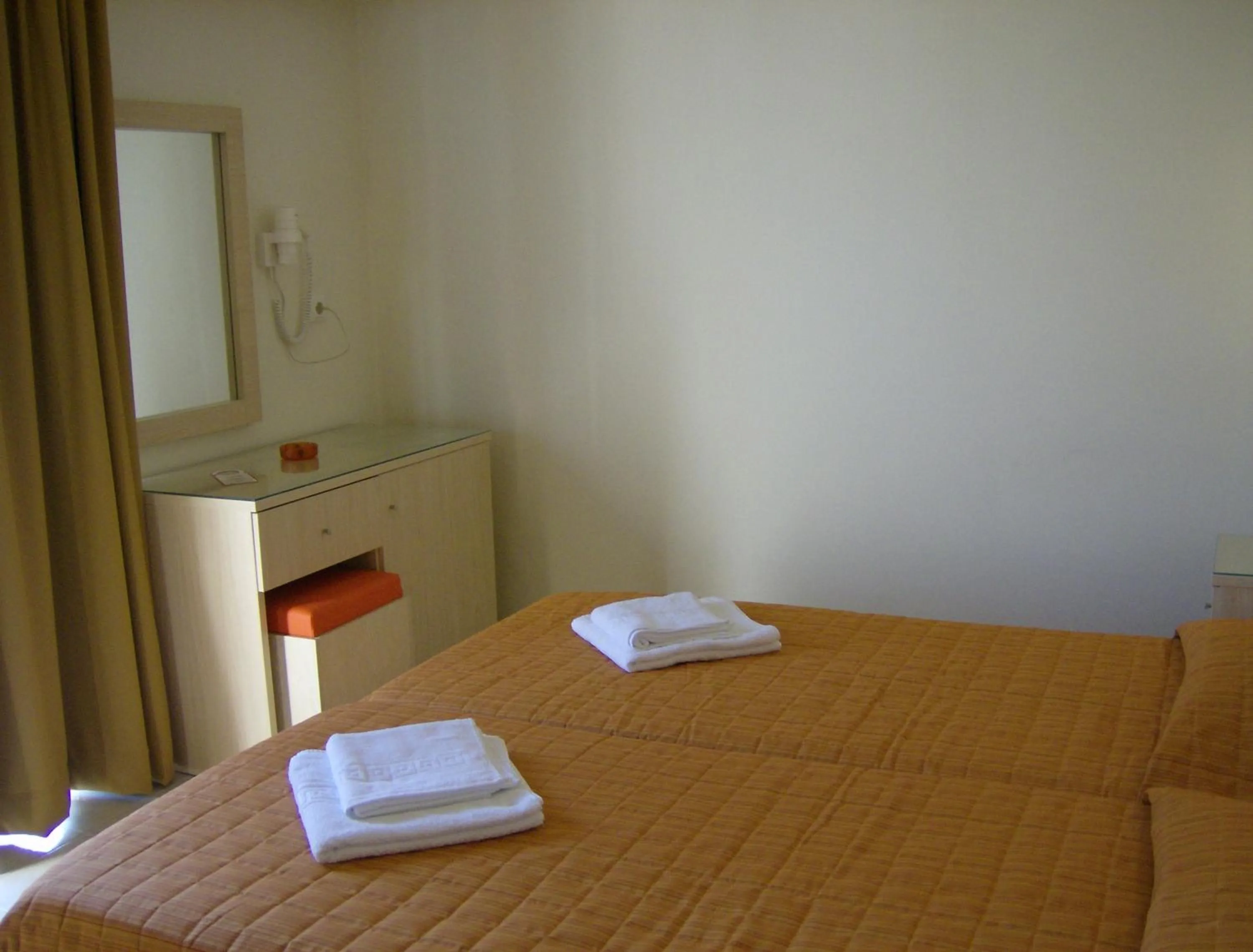 Bedroom in Amaryllis Hotel