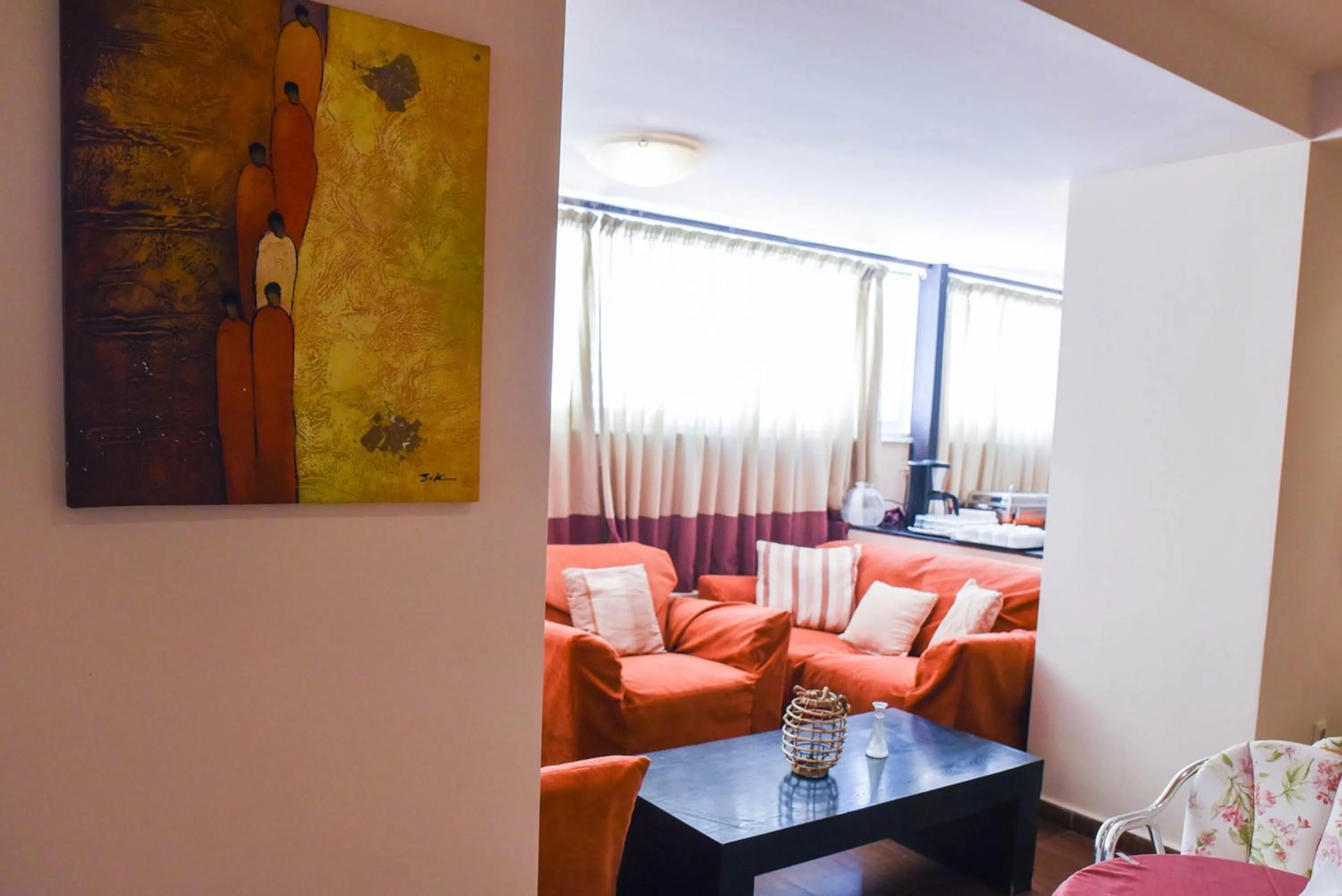 Communal lounge/ TV room, Seating Area in Amaryllis Hotel