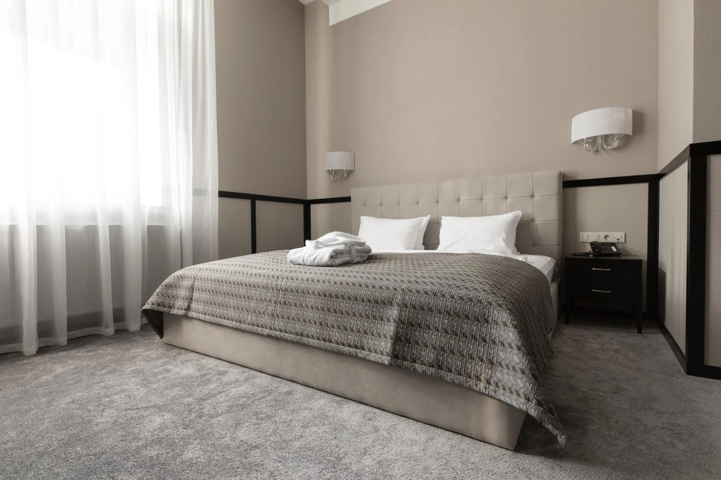 Bed in Tsunami Spa Hotel