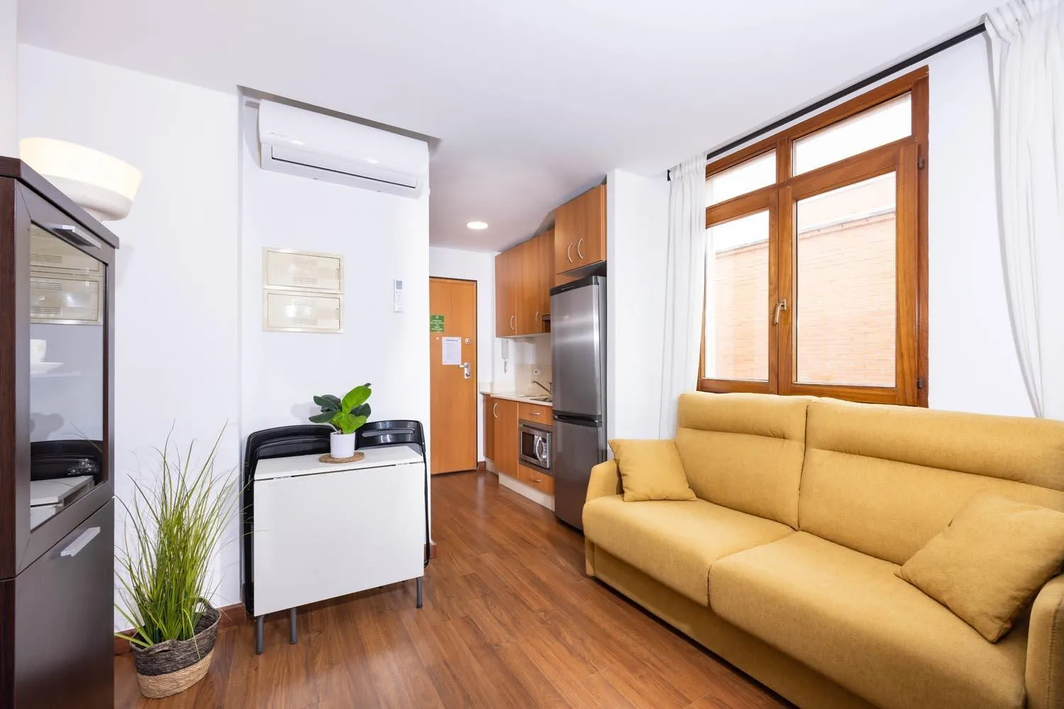 Living room in Apartamentos Turísticos Distrito Romano by CartagenaSpain