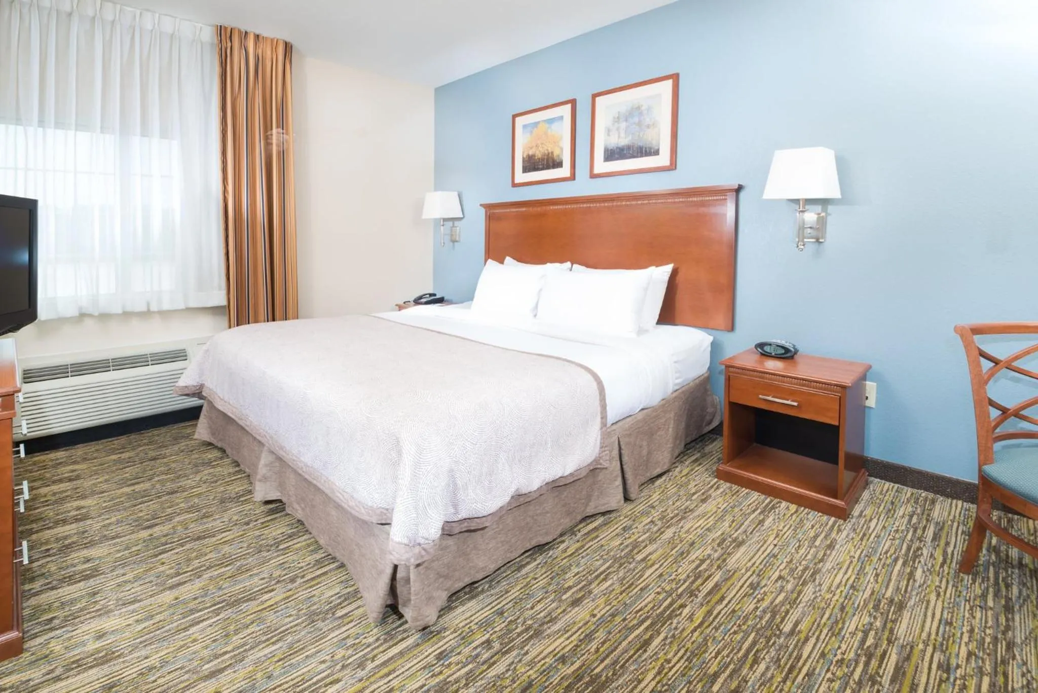 Photo of the whole room, Bed in Candlewood Suites Wake Forest-Raleigh Area by IHG