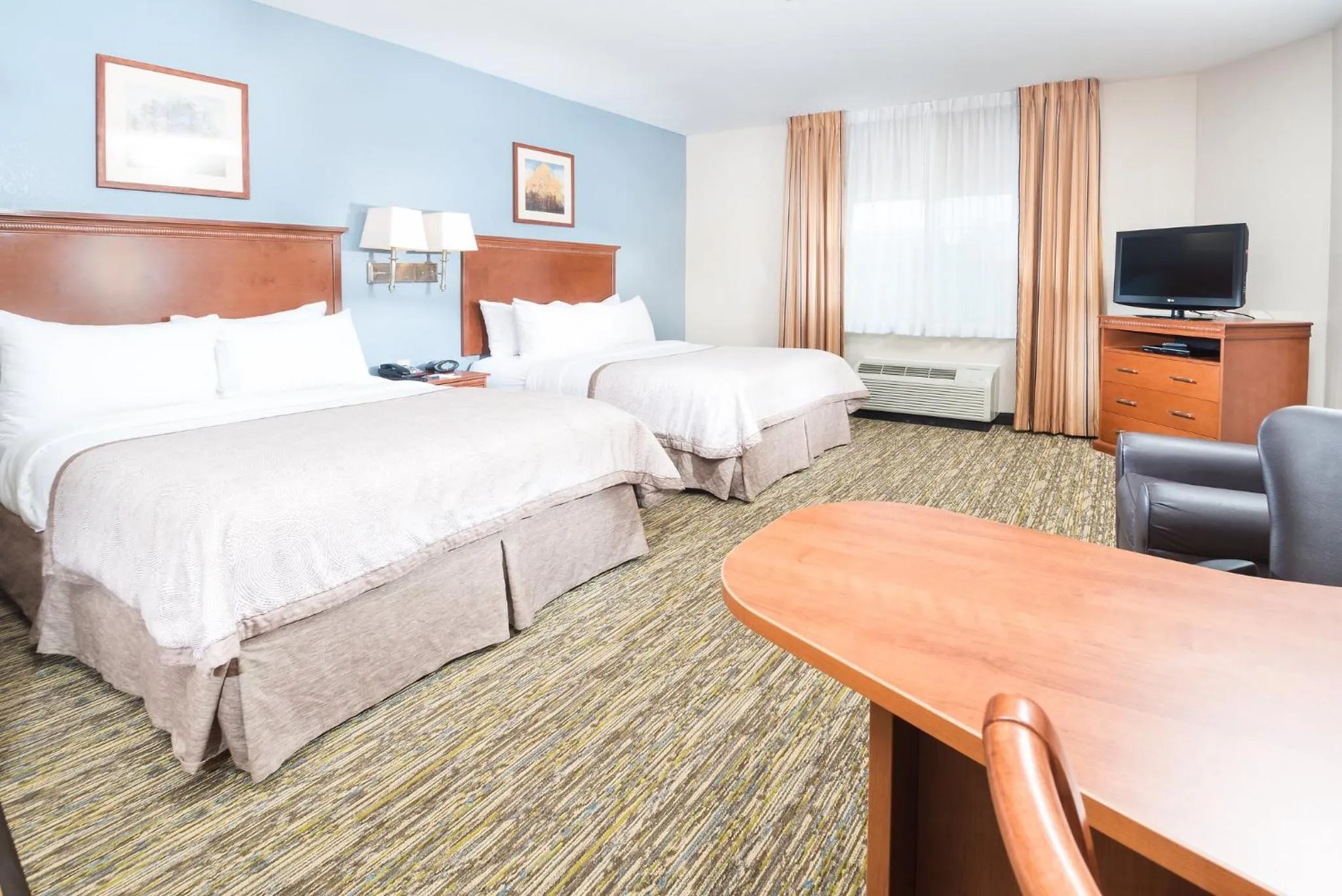 Photo of the whole room, Bed in Candlewood Suites Wake Forest-Raleigh Area by IHG