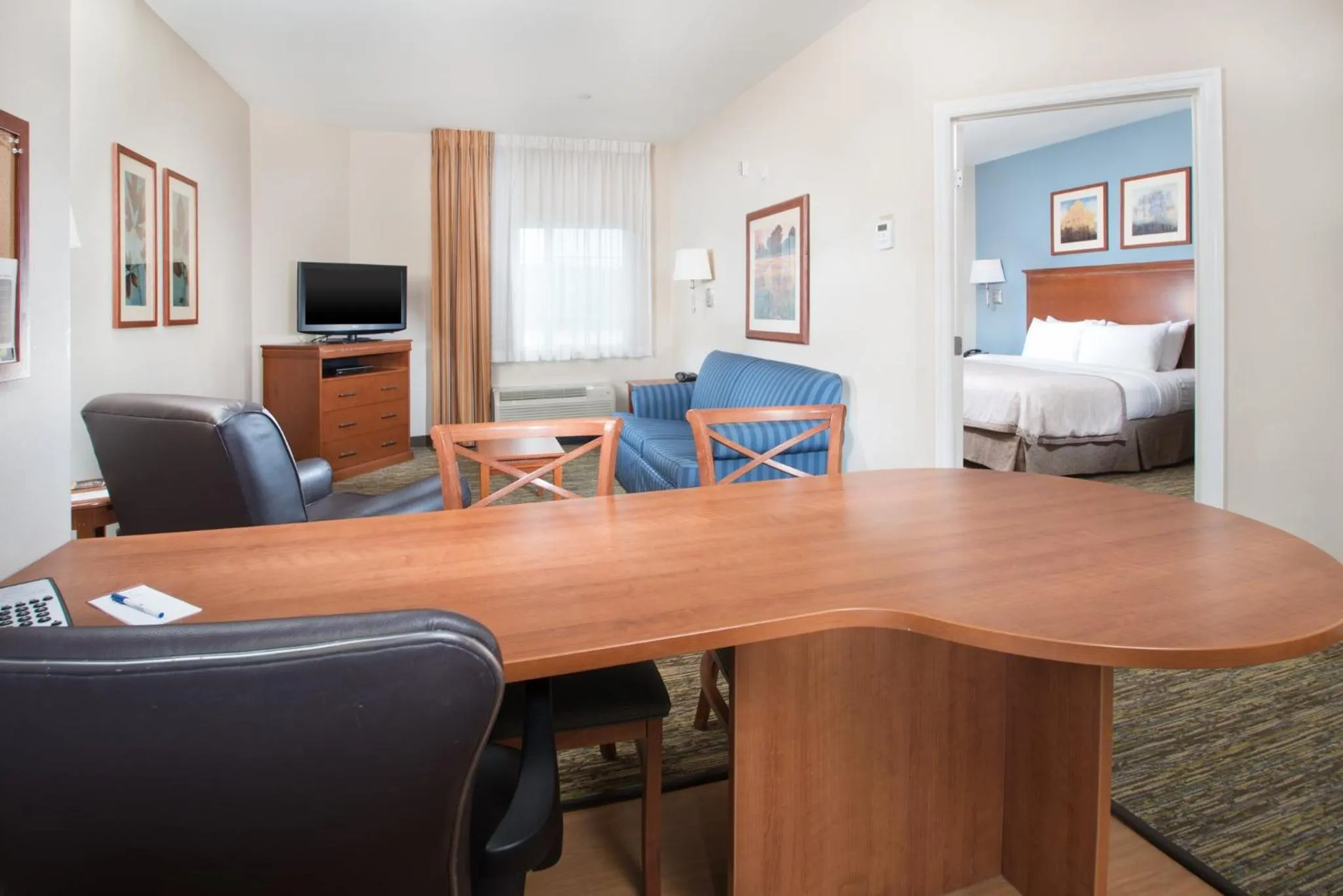 Photo of the whole room, Bed in Candlewood Suites Wake Forest-Raleigh Area by IHG