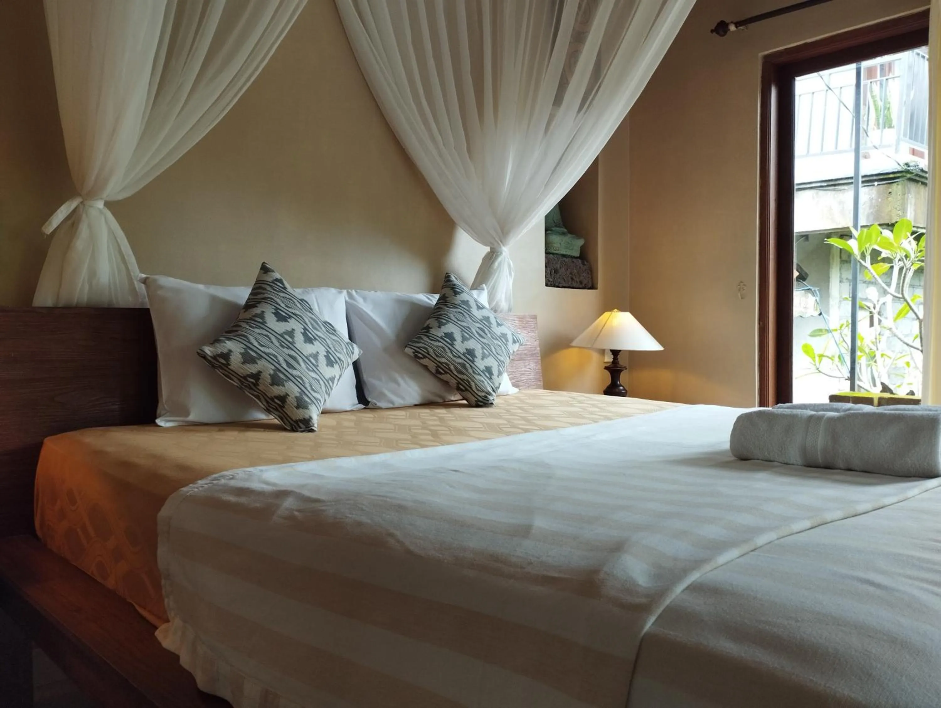 Bed in Umah Ubud Guest House