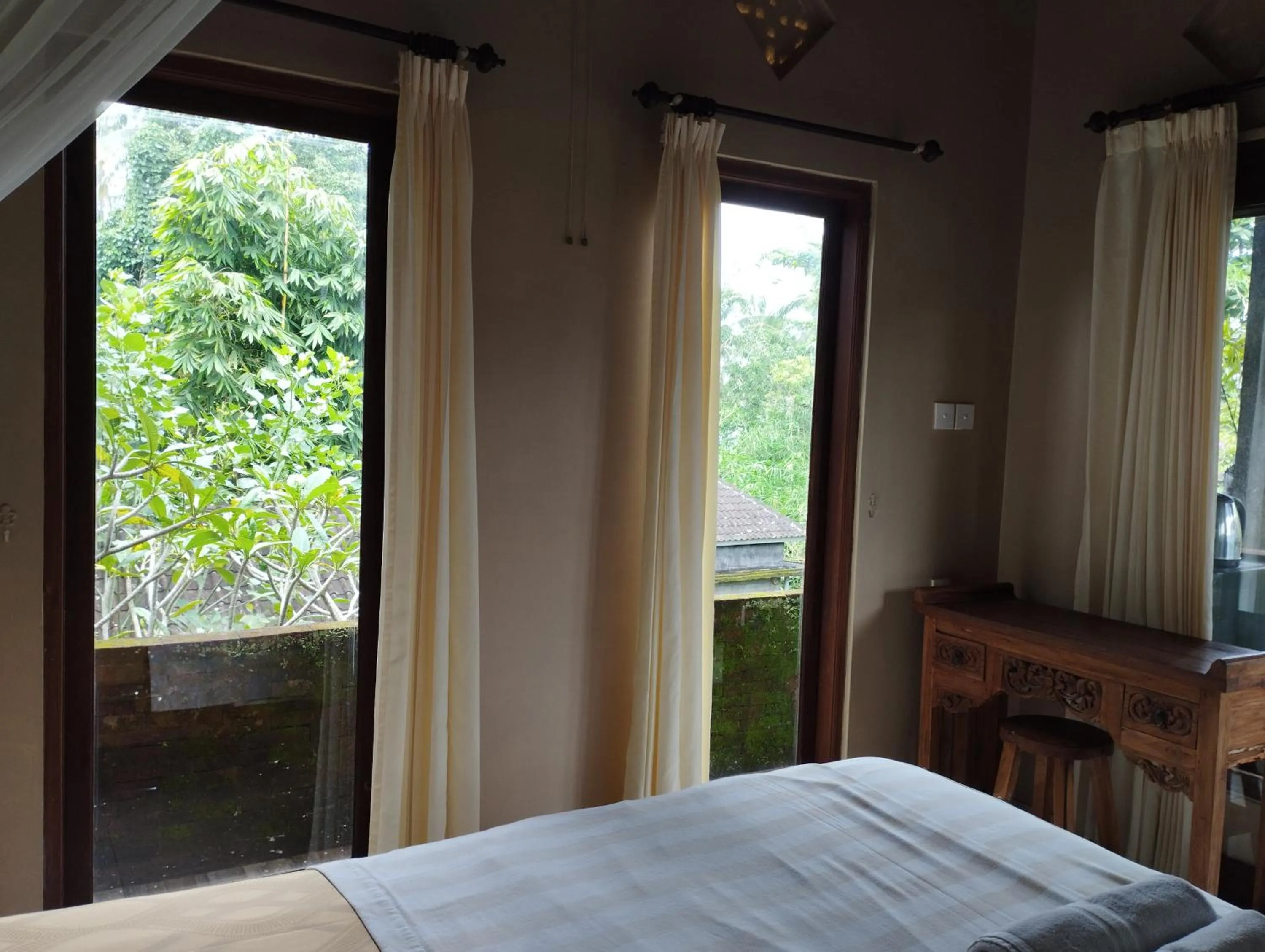 Bed in Umah Ubud Guest House
