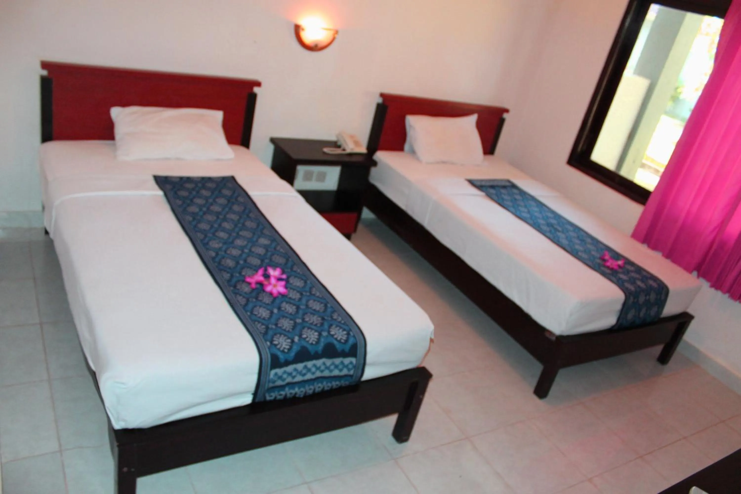 Bed in Aman Gati Hotel Lakey