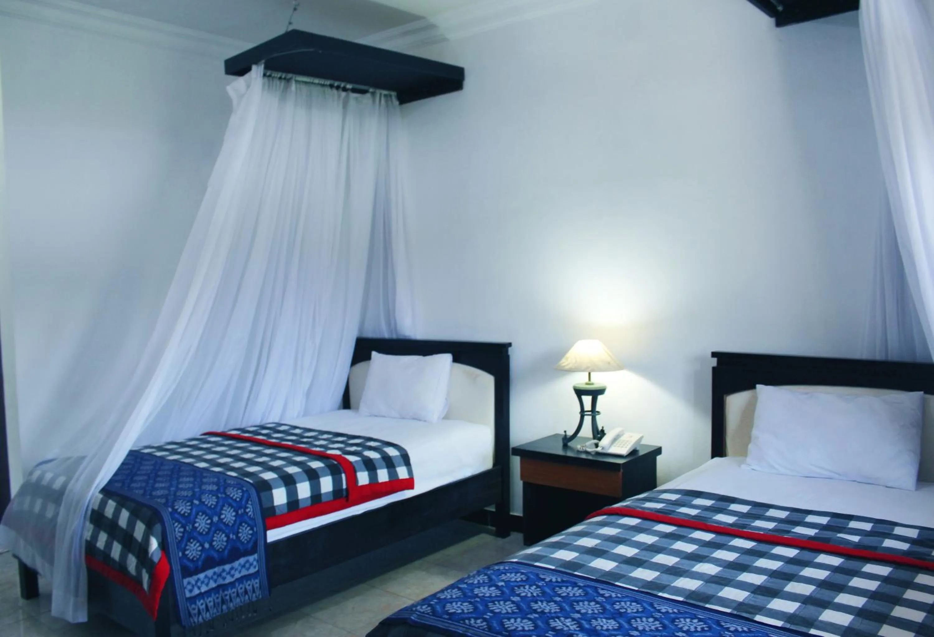 Bed in Aman Gati Hotel Lakey