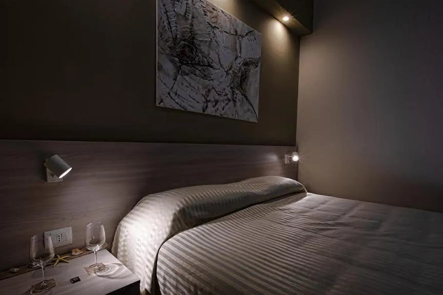 Bed in Hotel Scacciapensieri