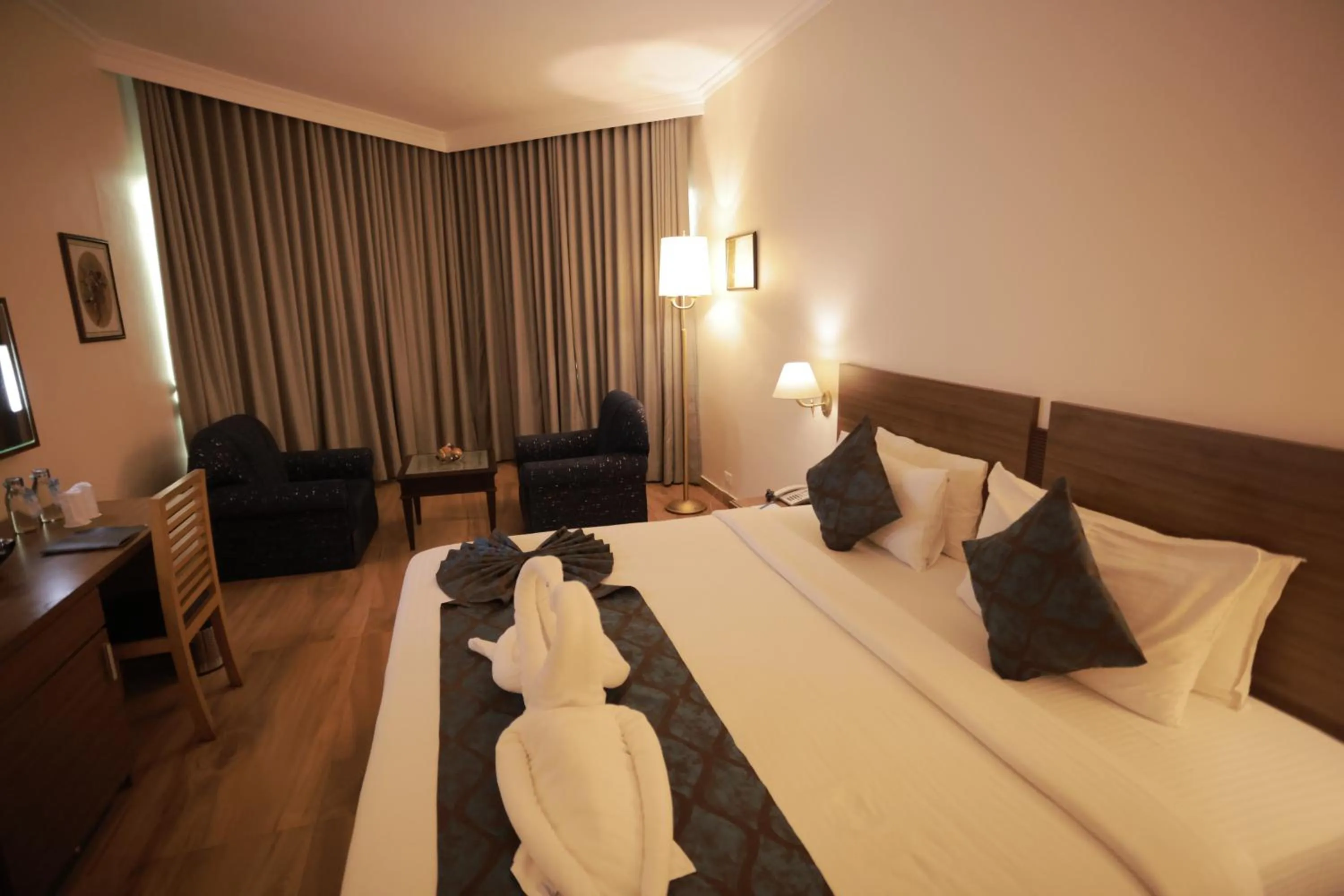 Bed in The Quilon Beach Hotel and Convention Center