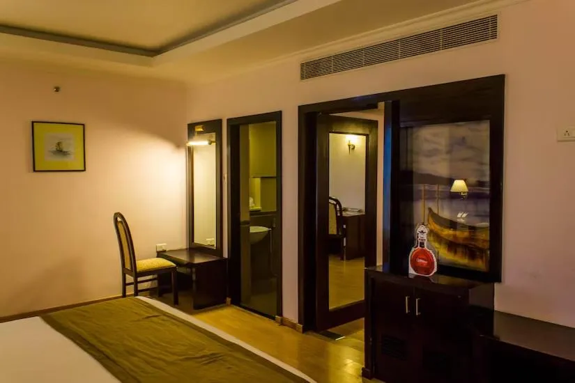 Living room, Bed in The Quilon Beach Hotel and Convention Center