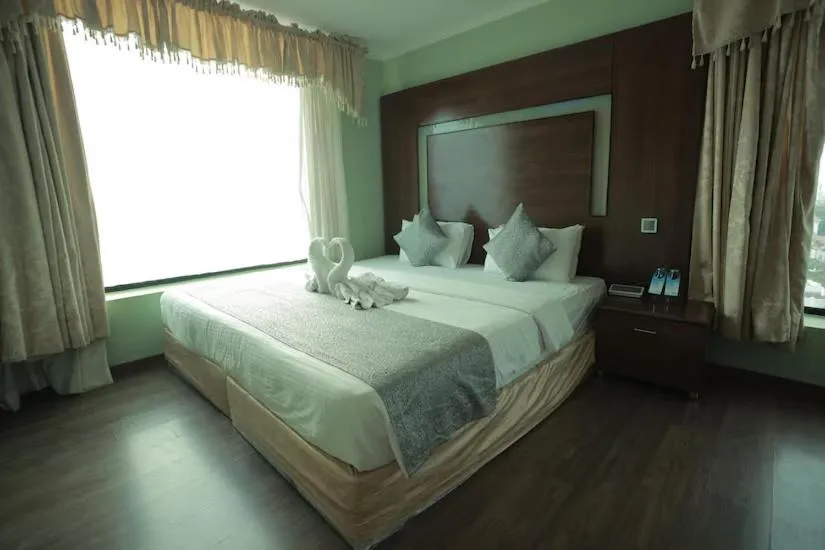 Bed in The Quilon Beach Hotel and Convention Center