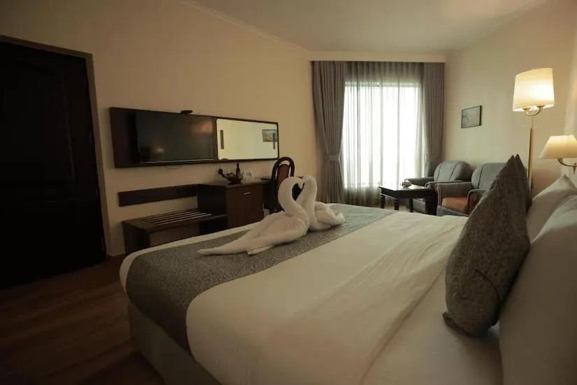 Bed in The Quilon Beach Hotel and Convention Center